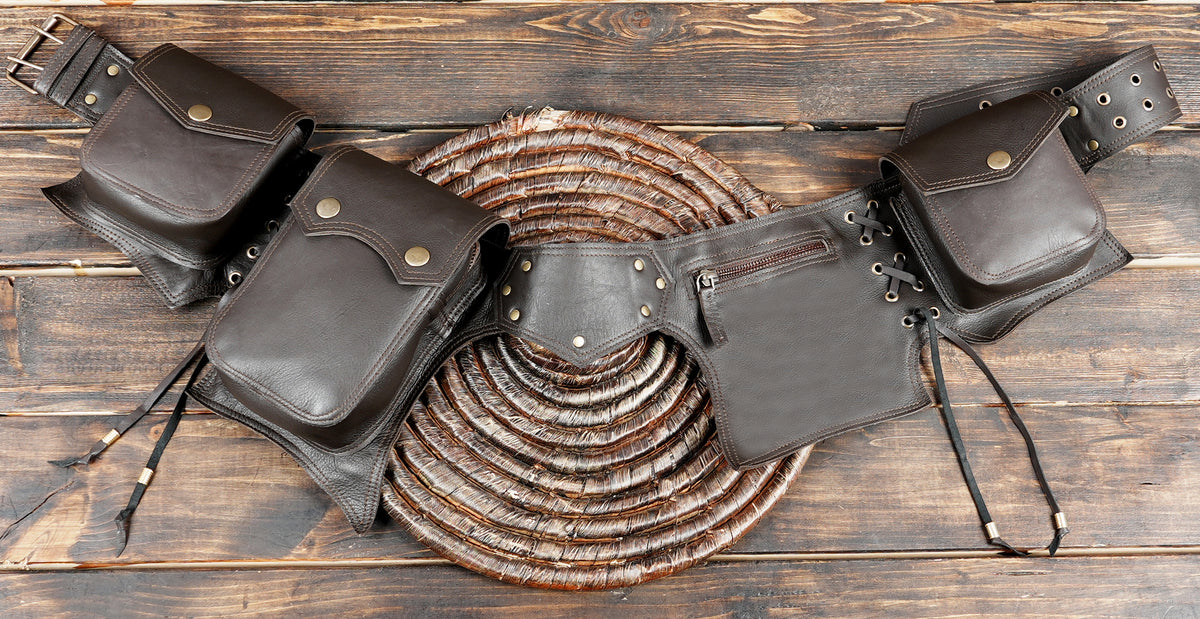 Handcrafted leather waist belt with studded pocket flaps