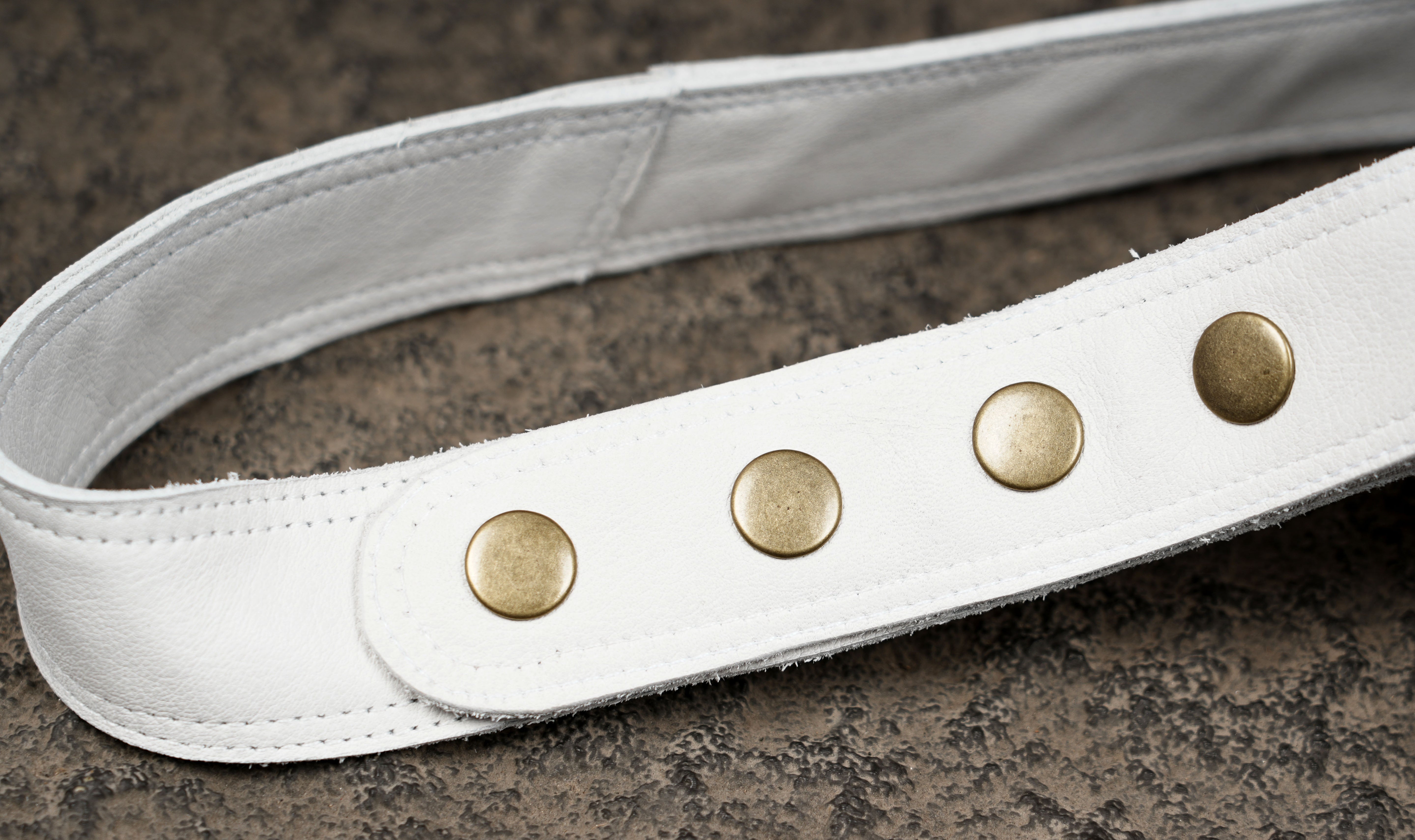 Handcrafted white leather fanny pack with stone medallion
