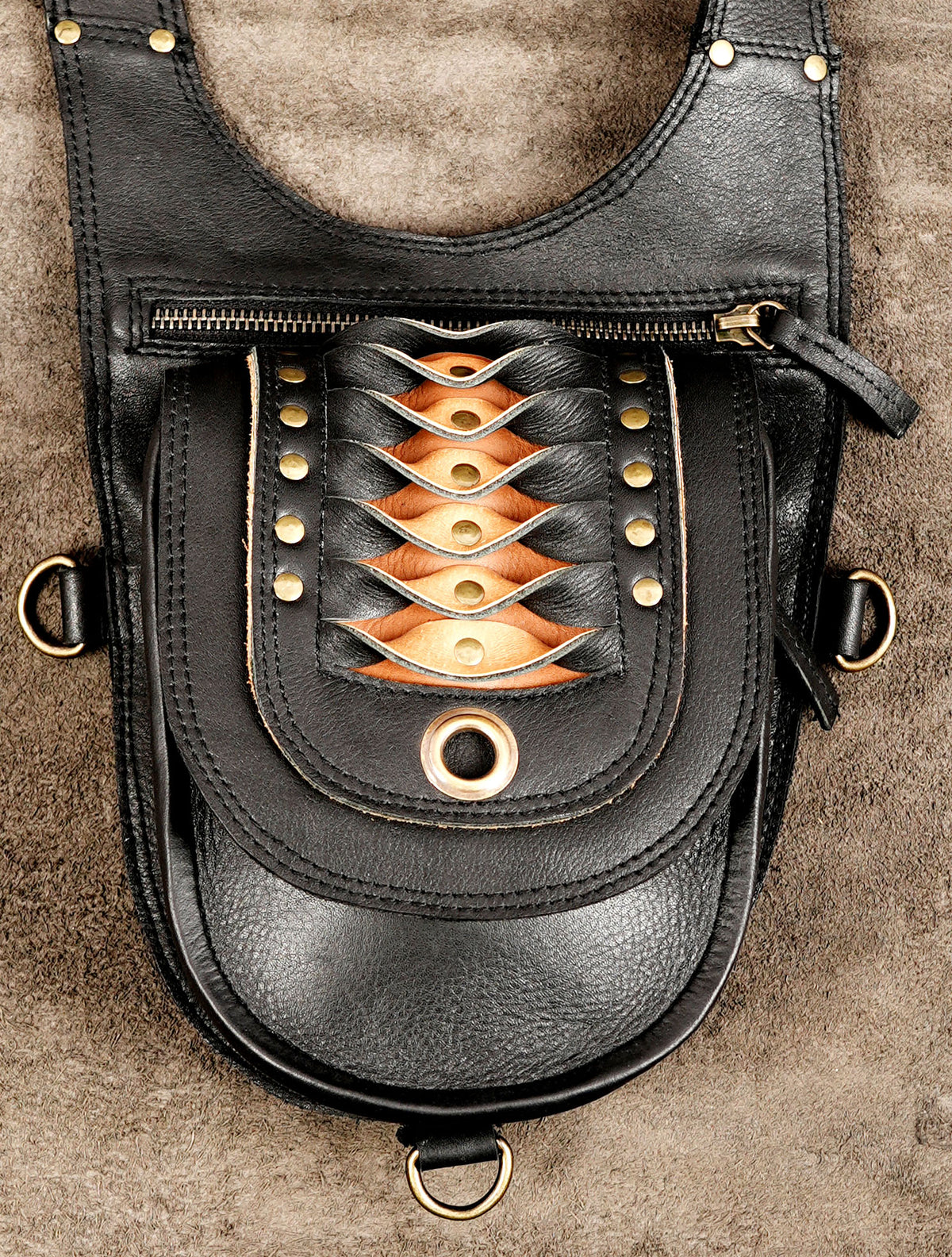 Gothic black leather double pouch holster with adjustable straps and brass hardware.