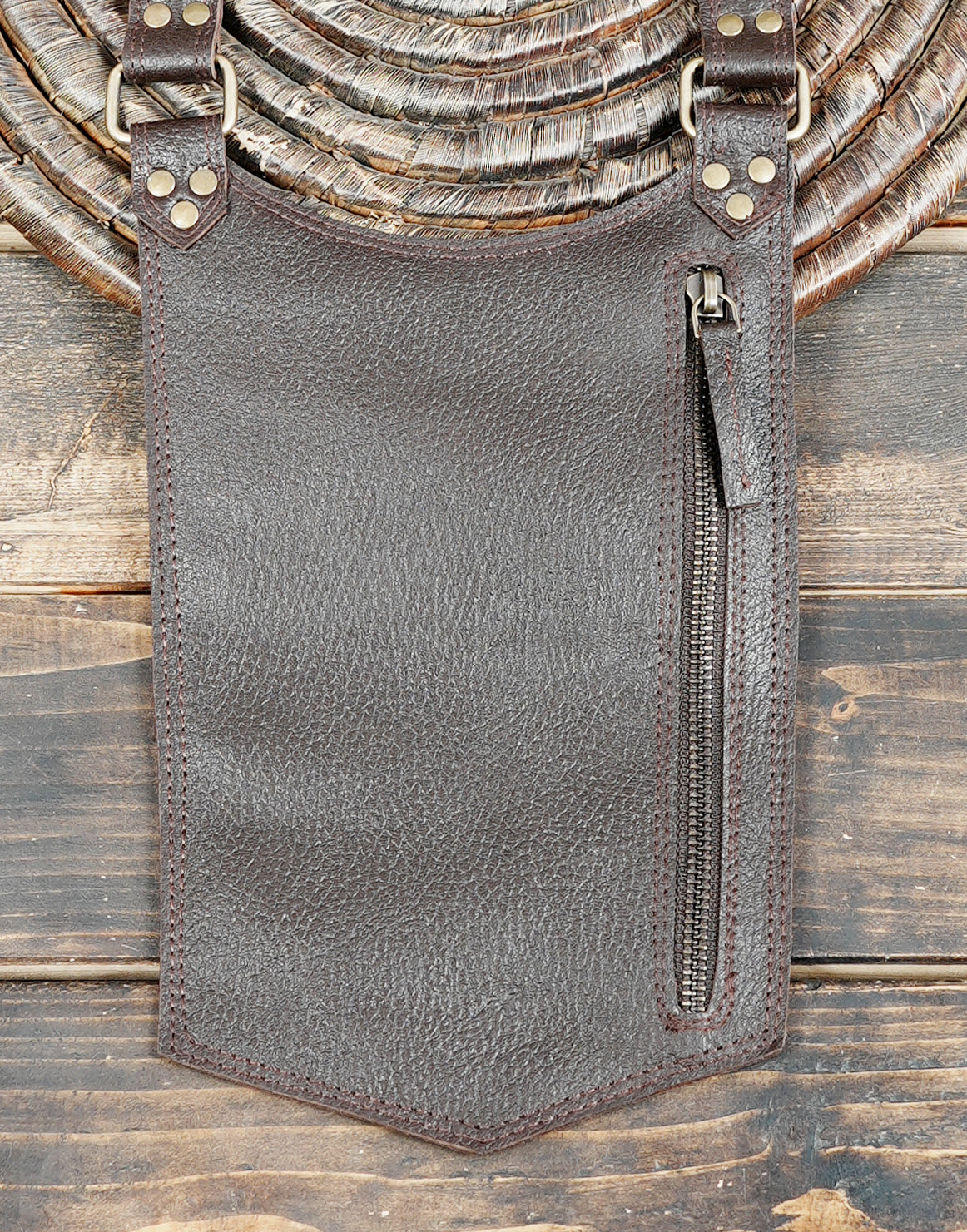 Handmade brown leather thigh holster bags with adjustable waist and leg straps for festivals.