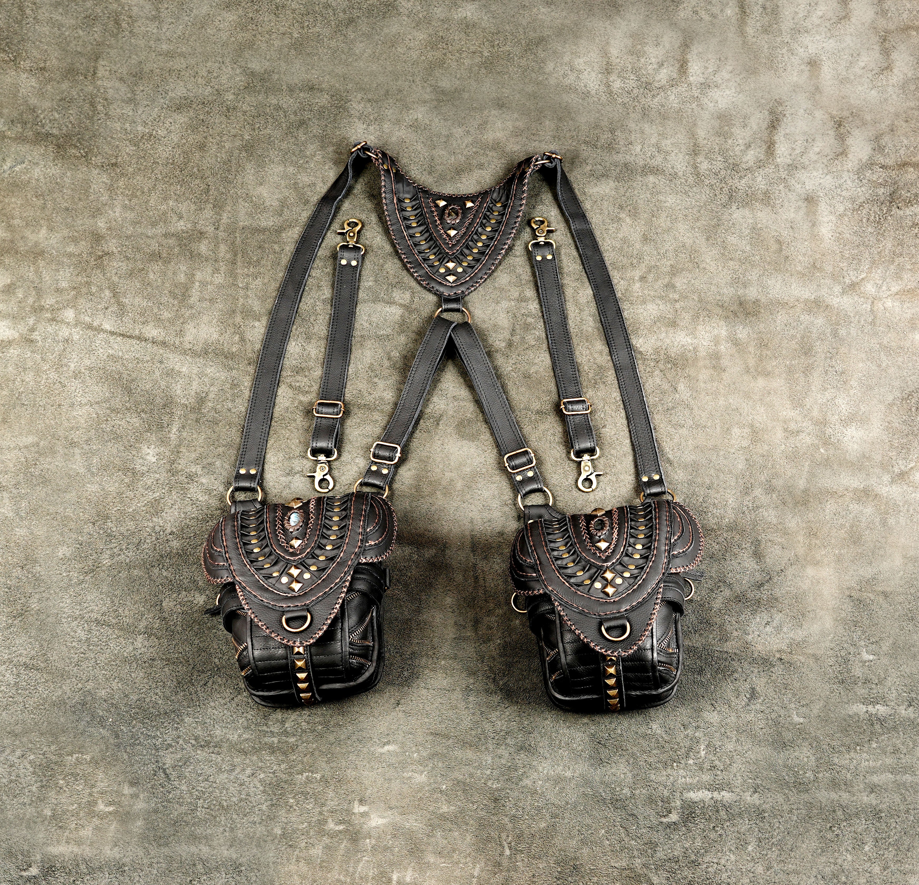 Handmade black leather shoulder harness bag with two utility pockets
