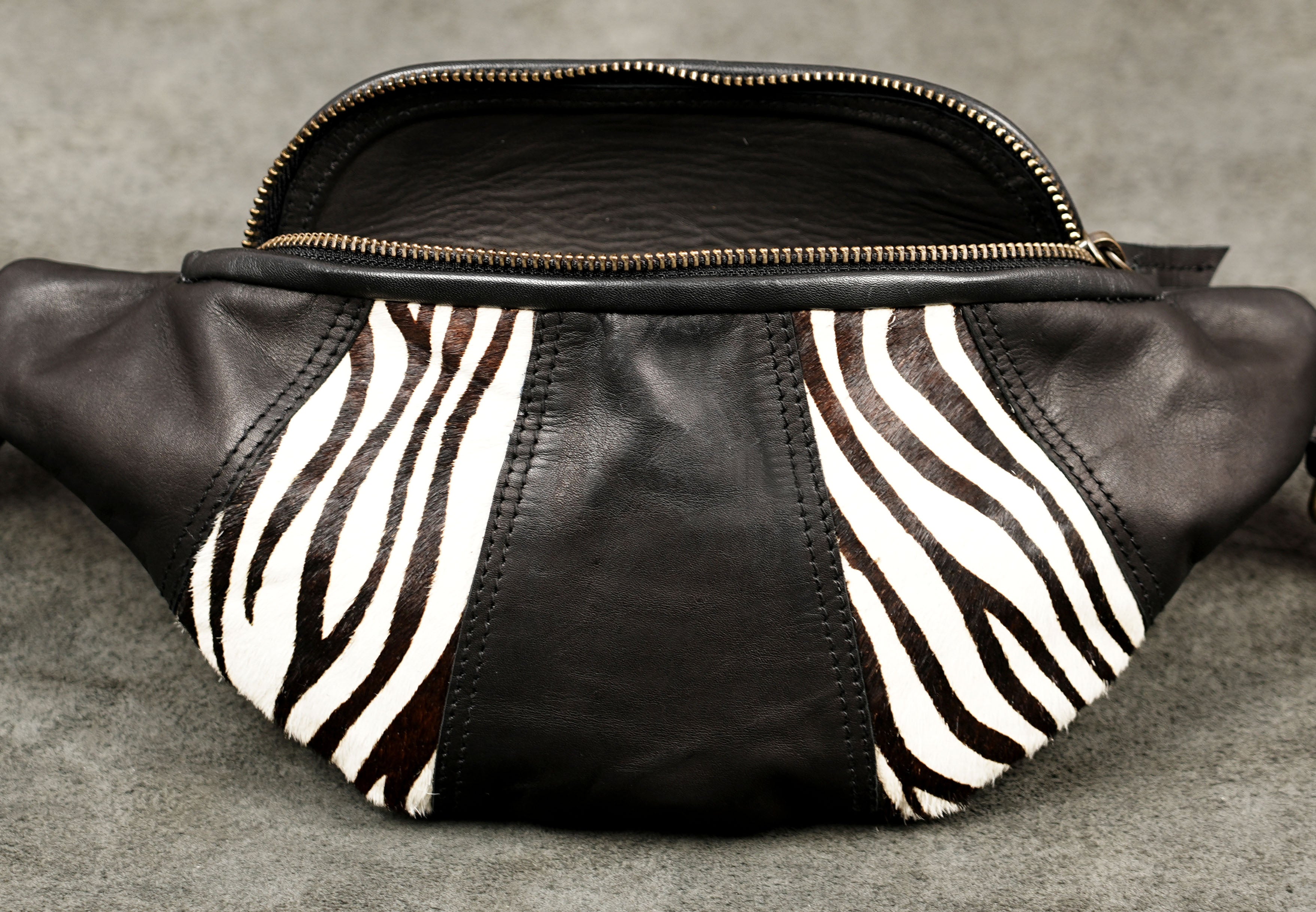 Handmade black leather travel bag with adjustable strap