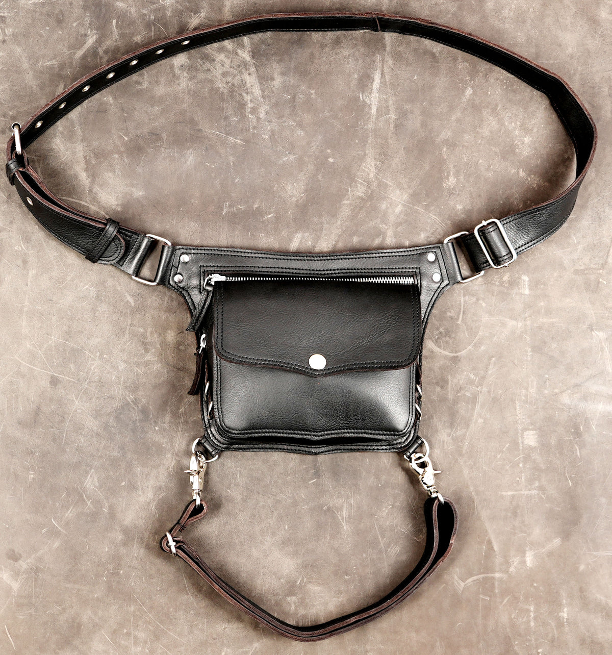 Handmade black leather waist and thigh bag with adjustable straps