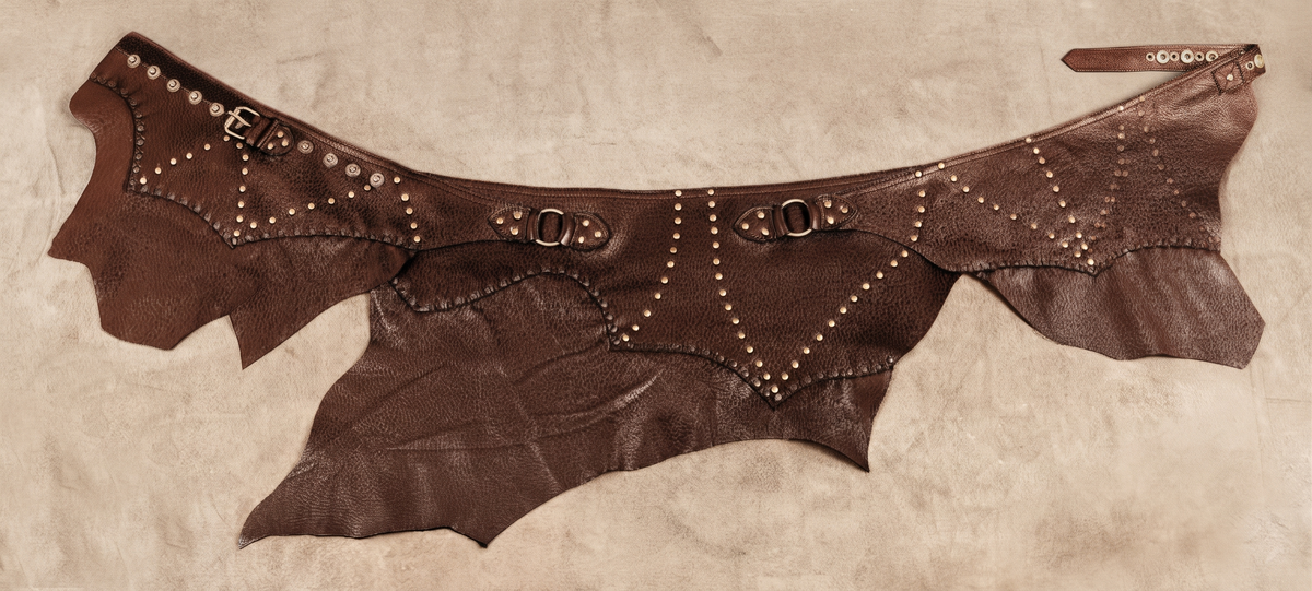 Boho steampunk leather skirt with decorative studs and textured leather panels