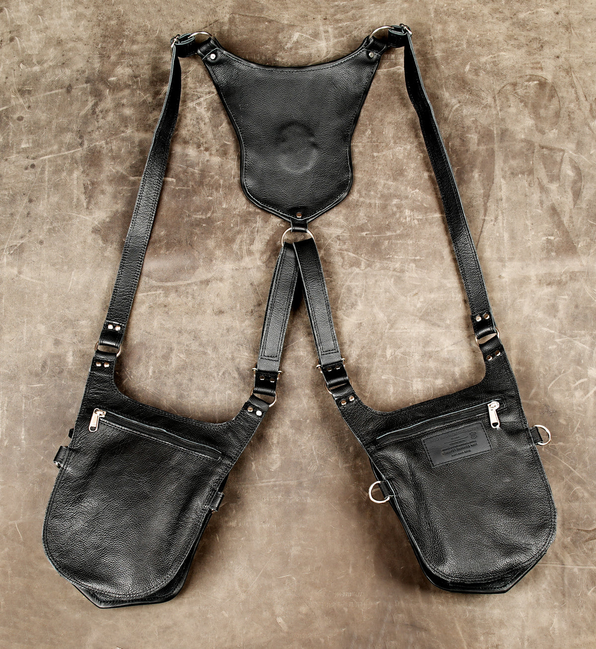 Handmade geometric leather harness with black and white detailing
