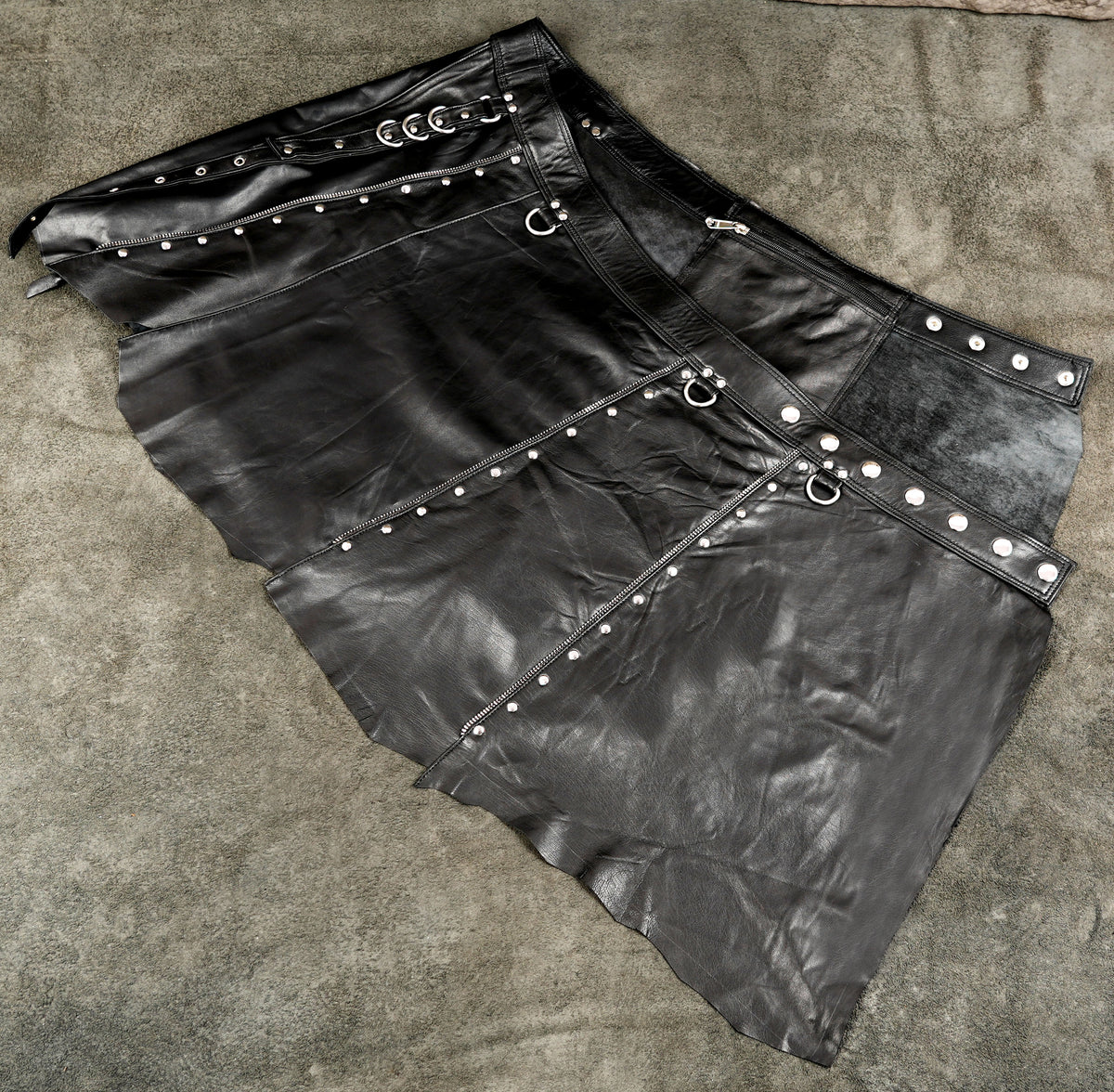 Handmade leather festival skirt with decorative metal rings