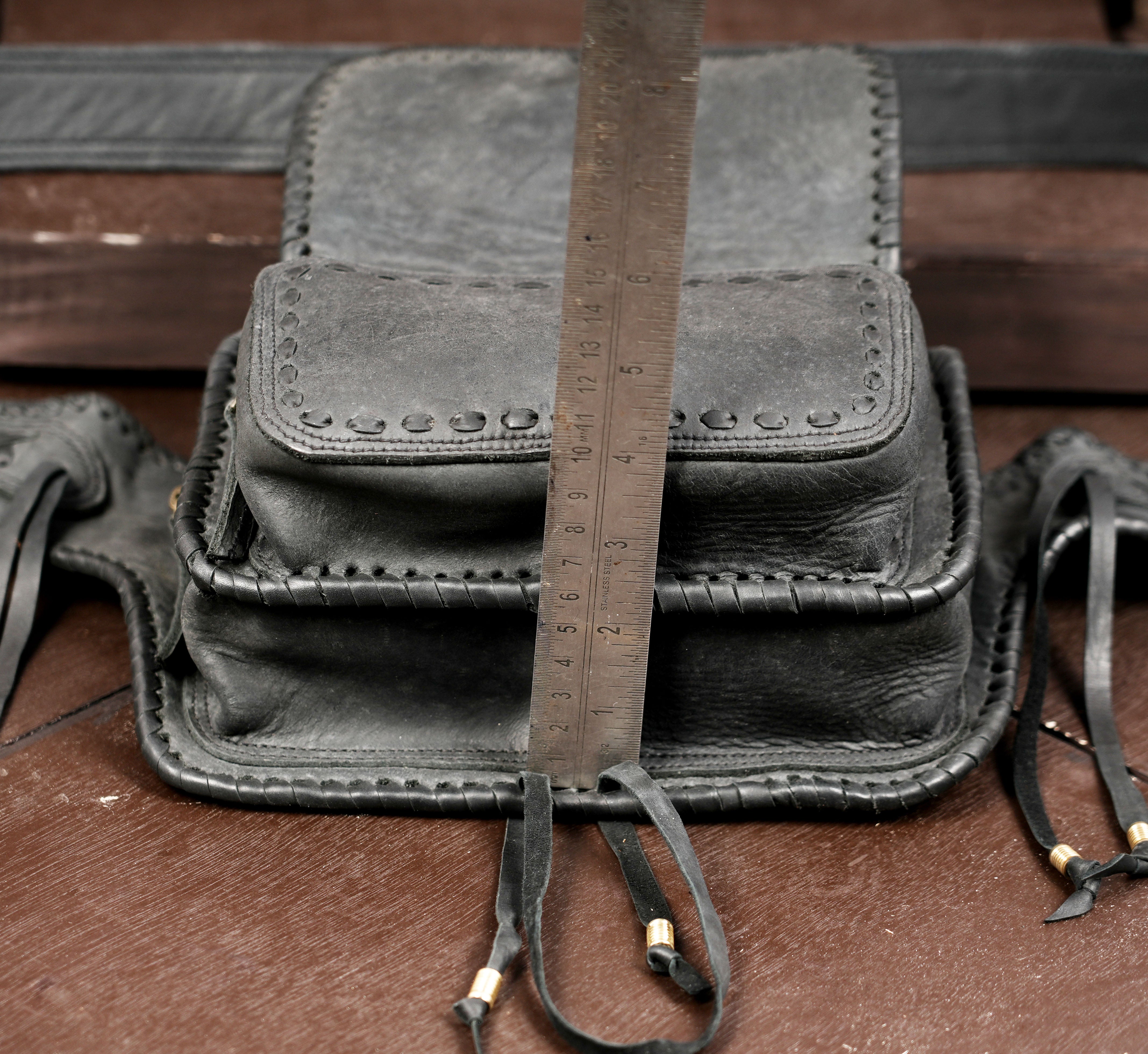 Handmade leather hip pouch with crystal medallion, full view
