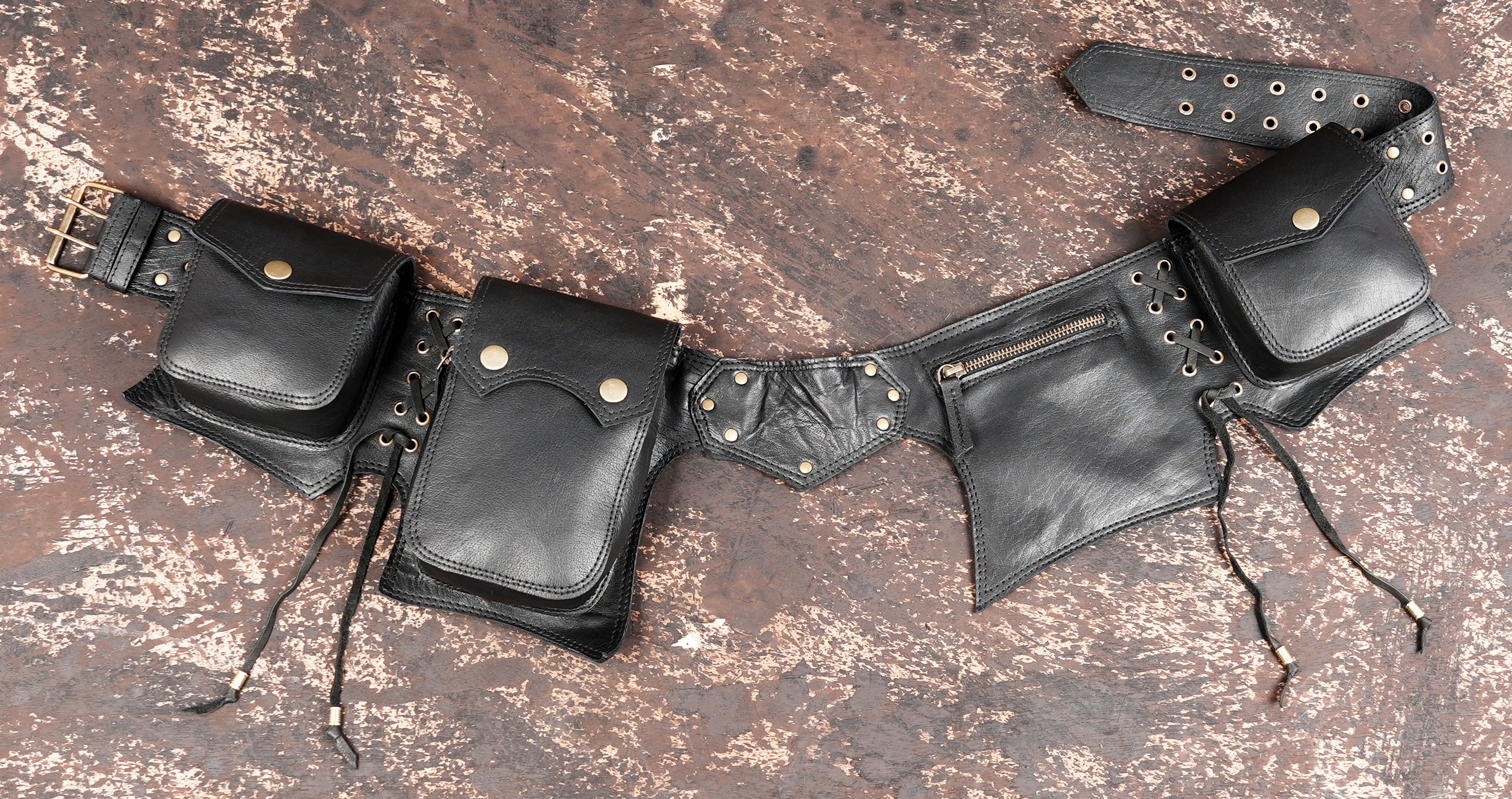 Handmade leather utility belt with five pockets and corset lacing