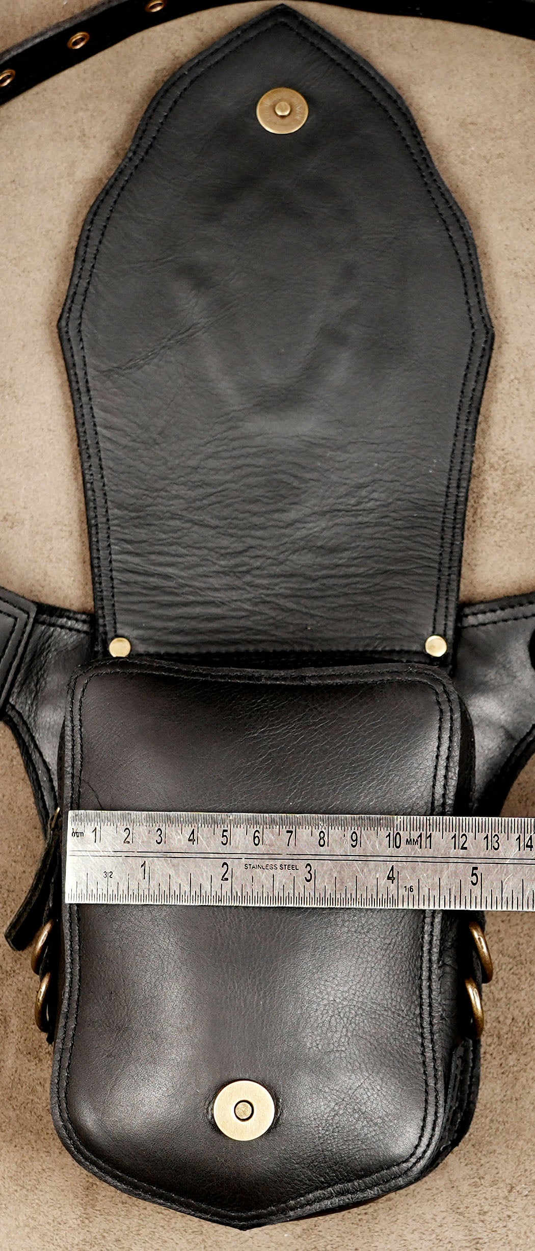 Hands-free black leather utility waist bag for outdoor adventures