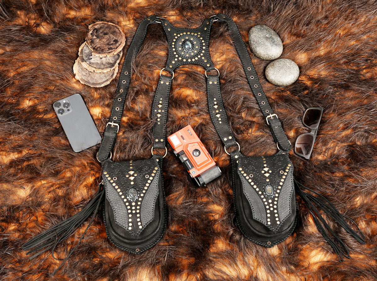 Black leather shoulder and thigh harness accessory with two matching pouches for cosplay costumes.