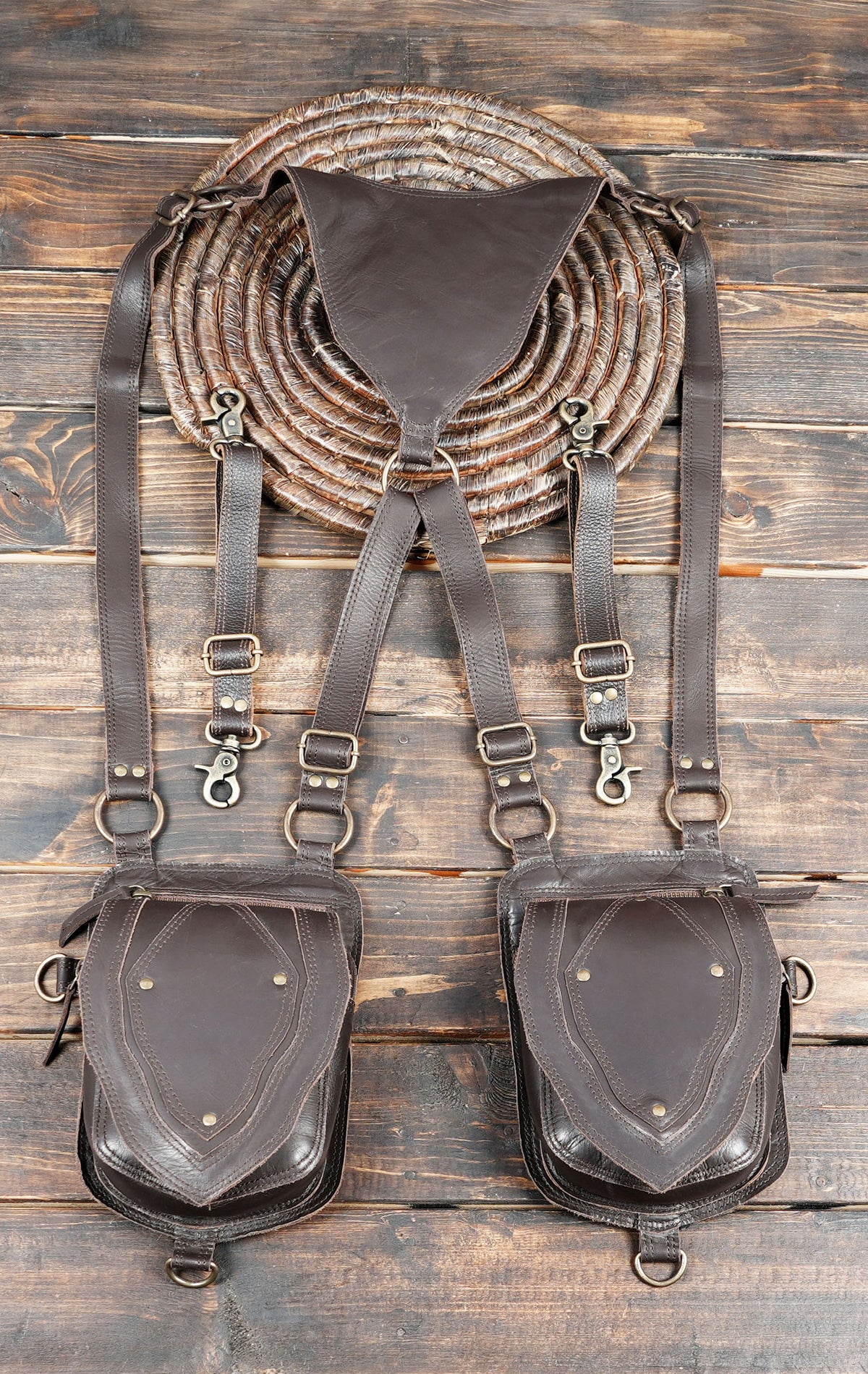 Brown leather chest harness bag with twin utility pouches for everyday essentials