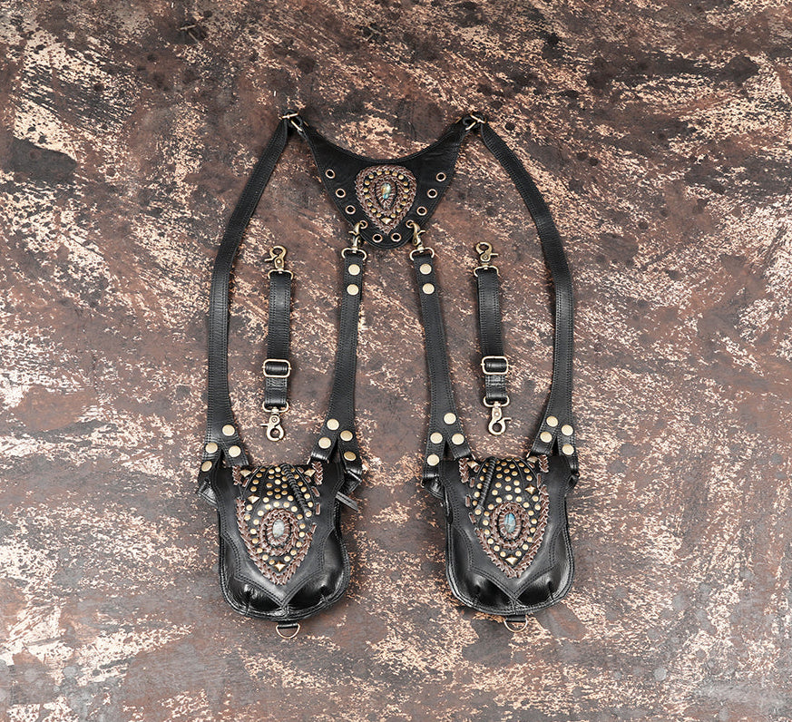 Black leather shoulder holster with dual utility pouches and brass studs