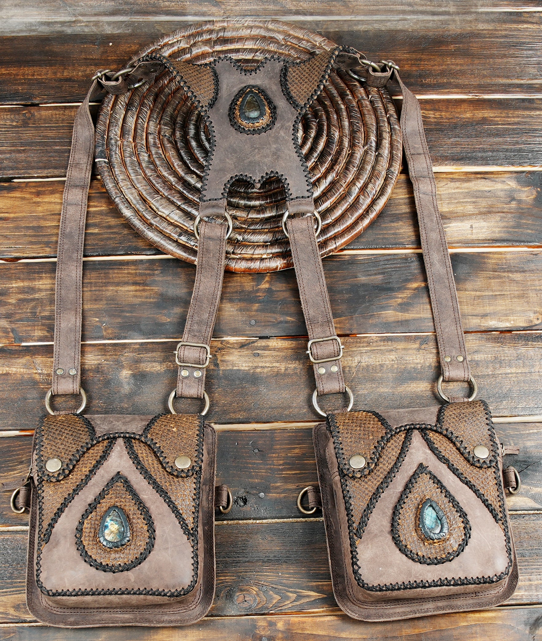 Crafted leather shoulder pouch set with natural gemstone design