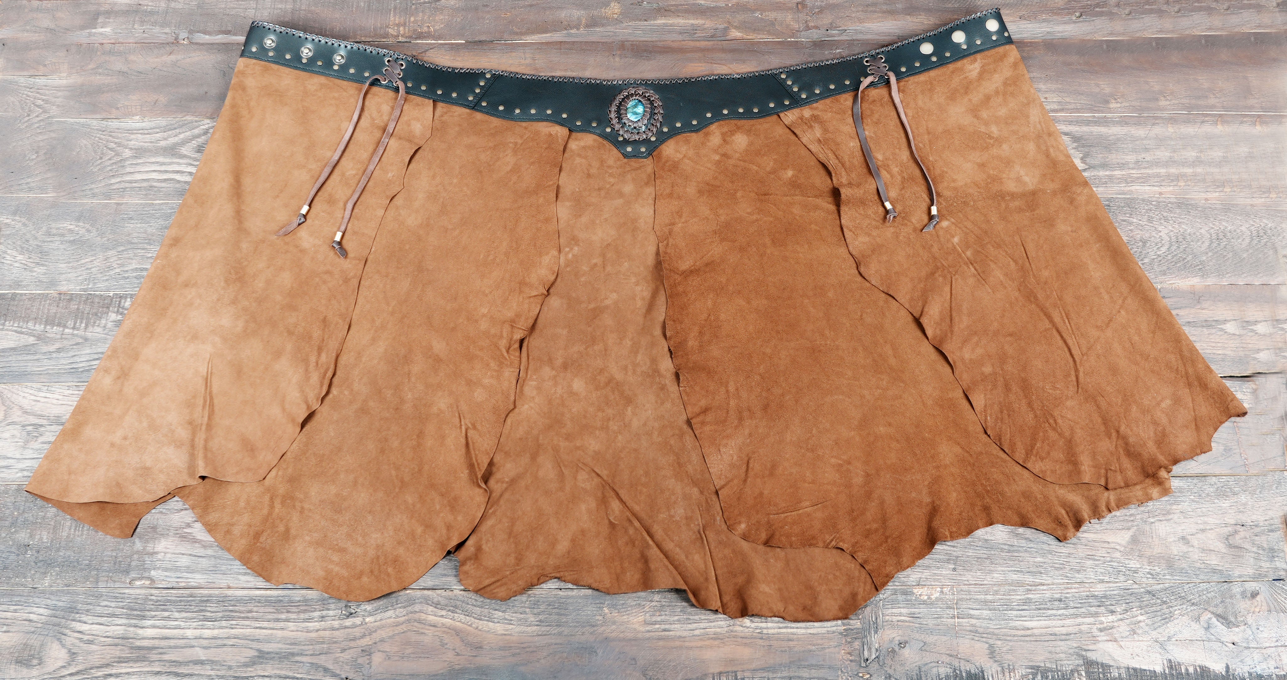 Layered suede skirt with gemstone centerpiece and studs