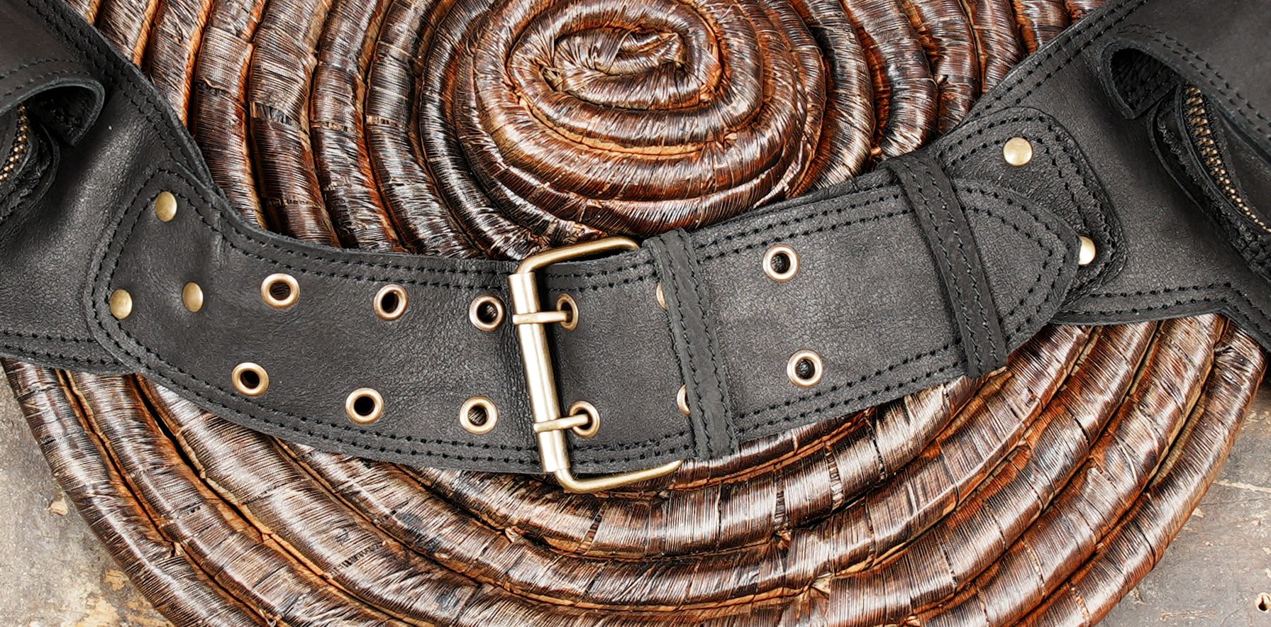 Leather double pocket belt bag styled on rustic wood background