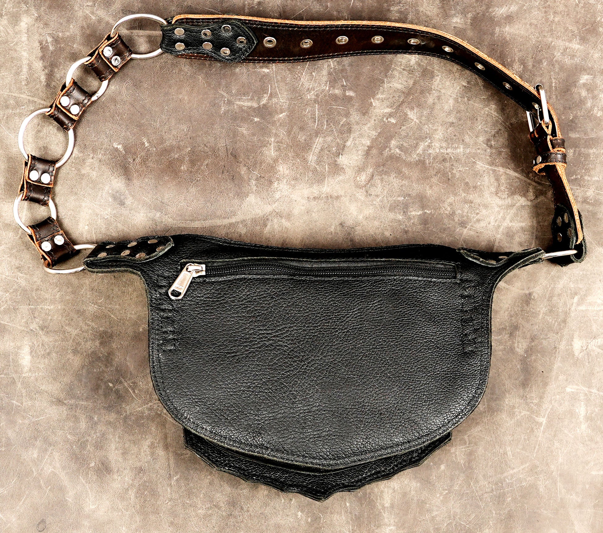 Leather festival accessory, gemstones displayed above bag