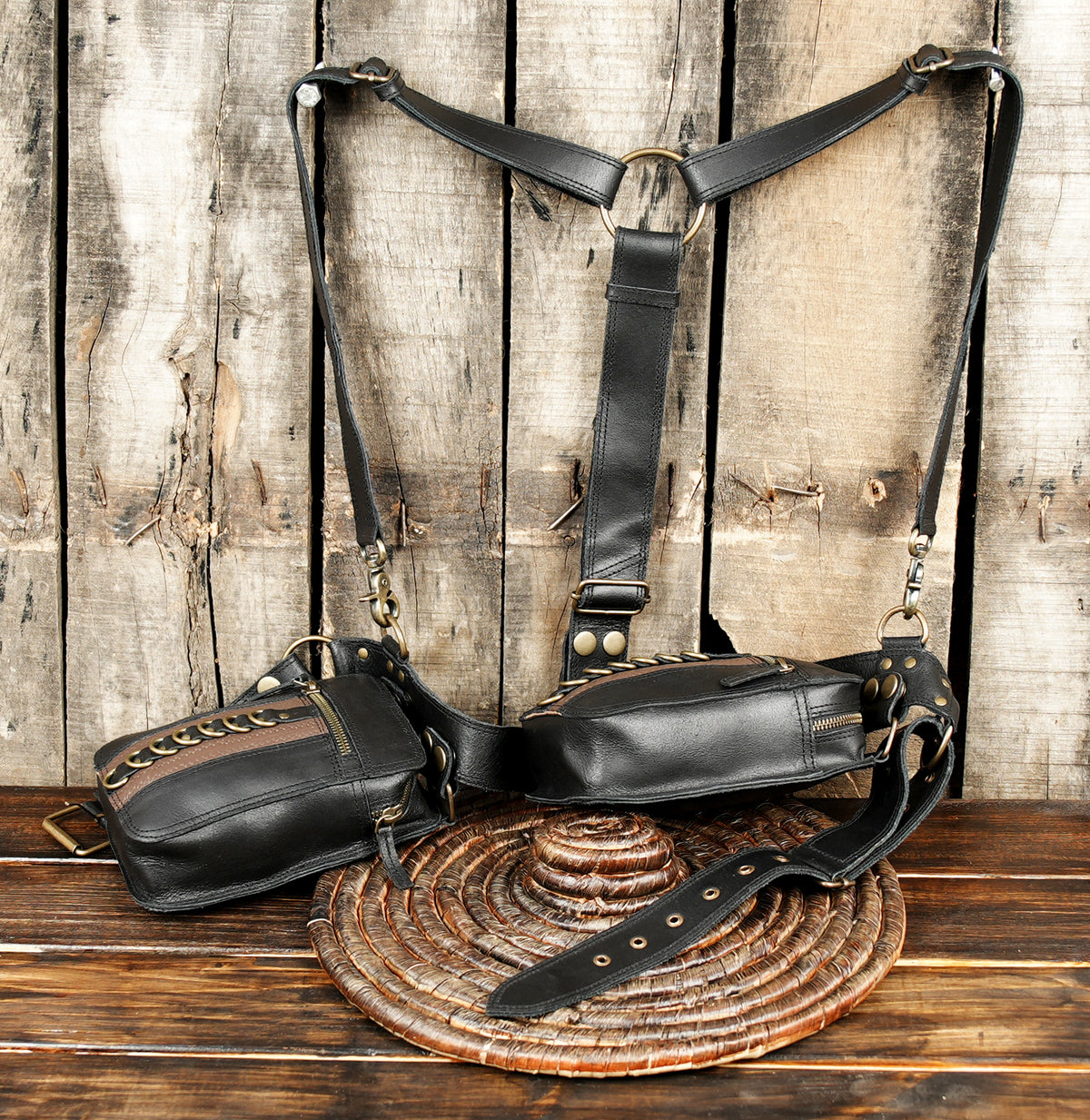 Sleek black leather utility harness with metal rivets and dual holsters