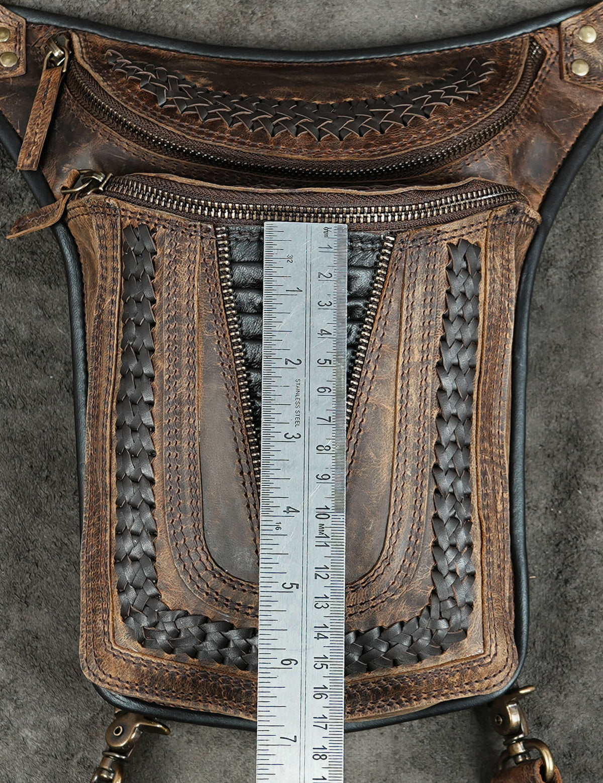 Motorcycle style leather hip bag with hardware
