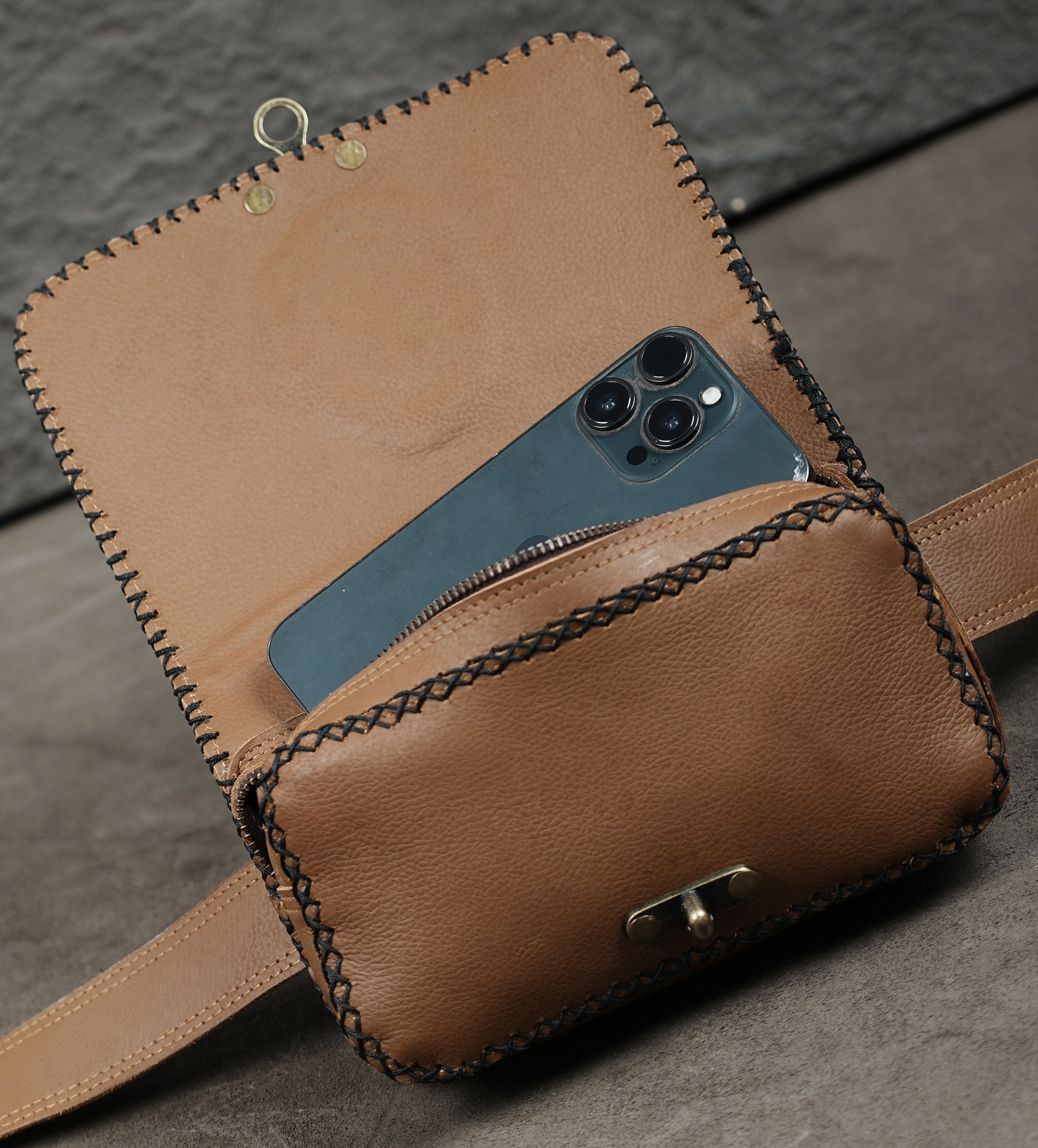 Natural labradorite stone set on a leather belt bag
