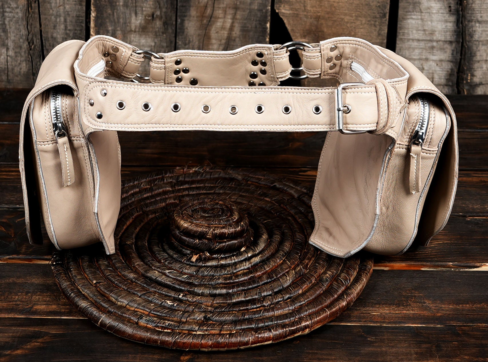 Pale leather accessory belt with stud and grommet detail