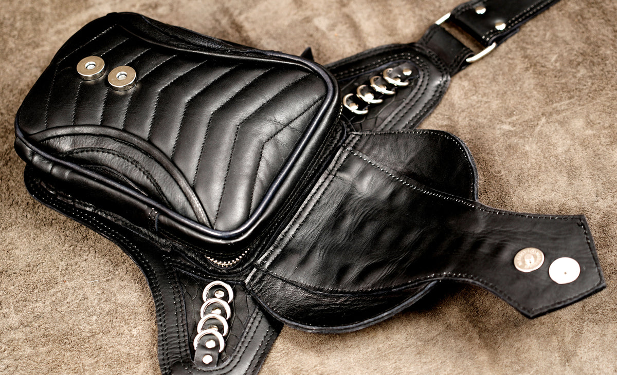 Post-apocalyptic style leather bag with metal trim
