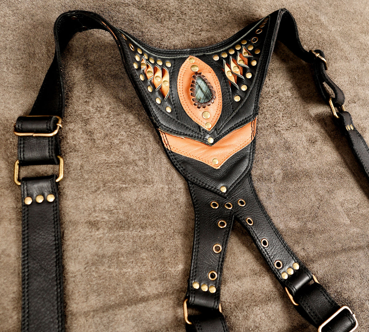 Black leather steampunk shoulder bag with dual holster pouches and a natural stone detail.
