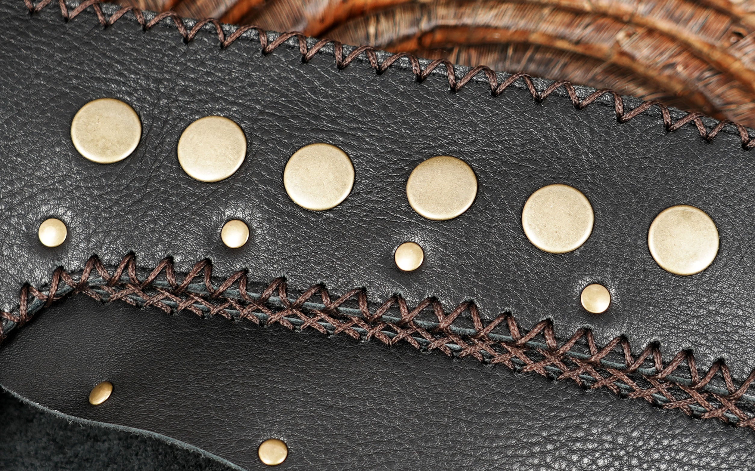 Punk leather skirt with whipstitch trim, flat lay view