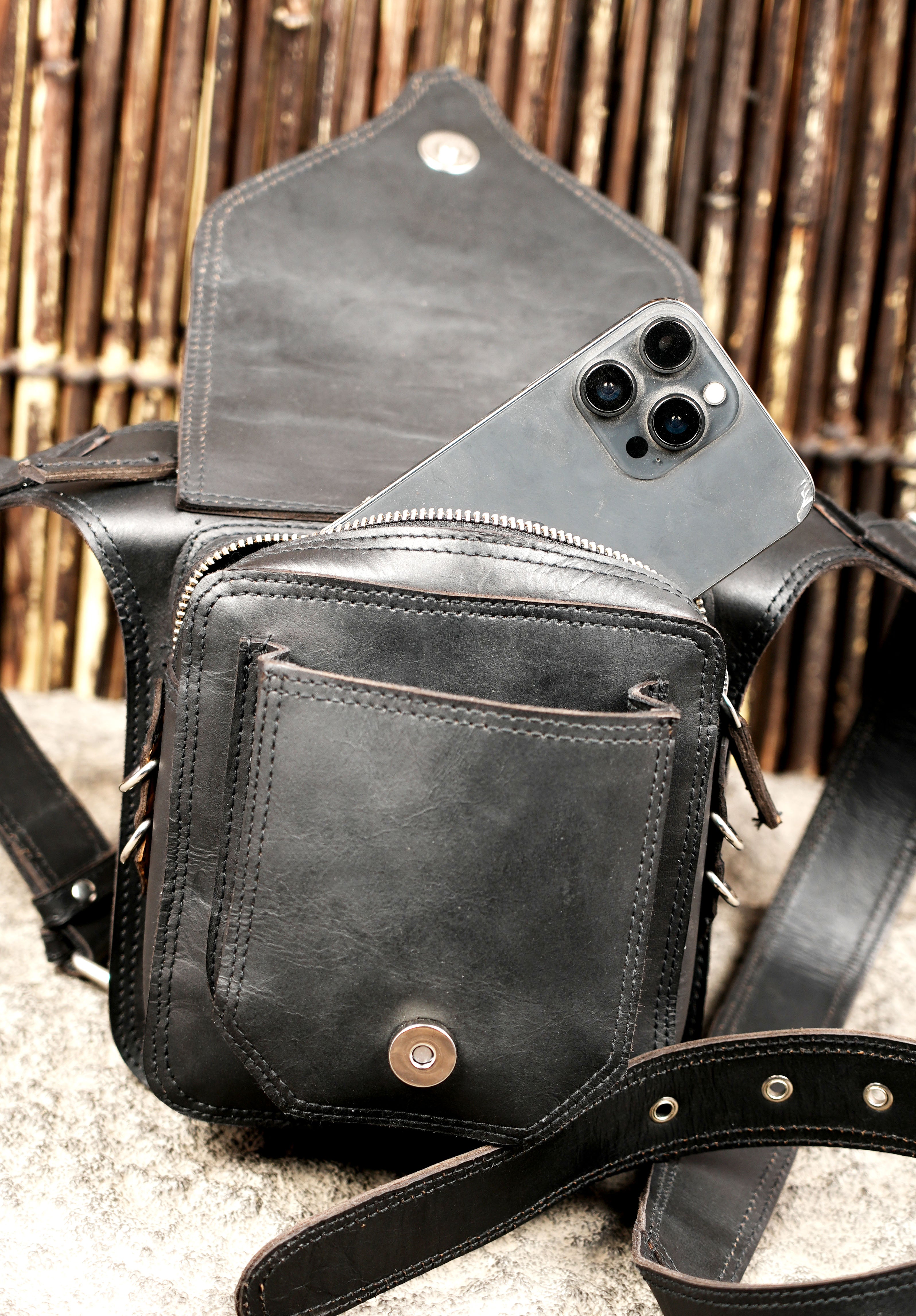 Punk style leather festival bag with studded design