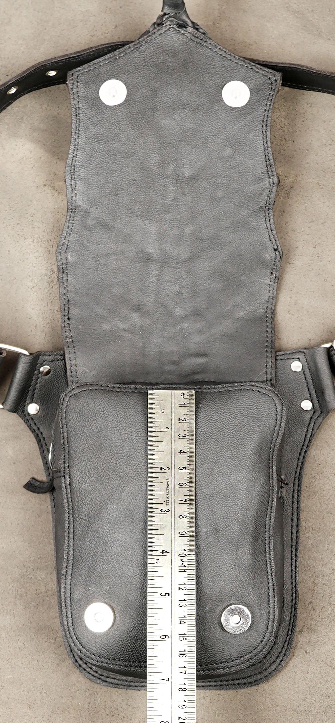 Rock leather pouch with braided leather and tassel detail