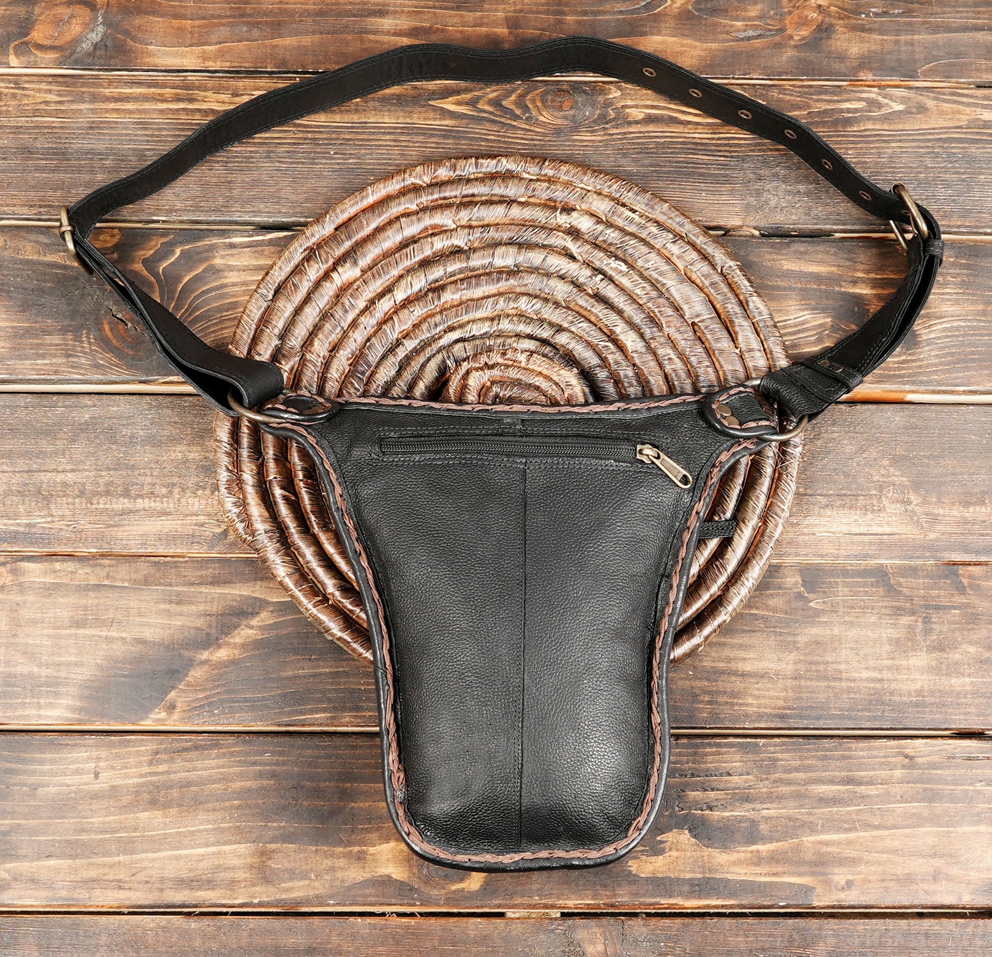 Rustic black and brown leather waist bag for outdoor events