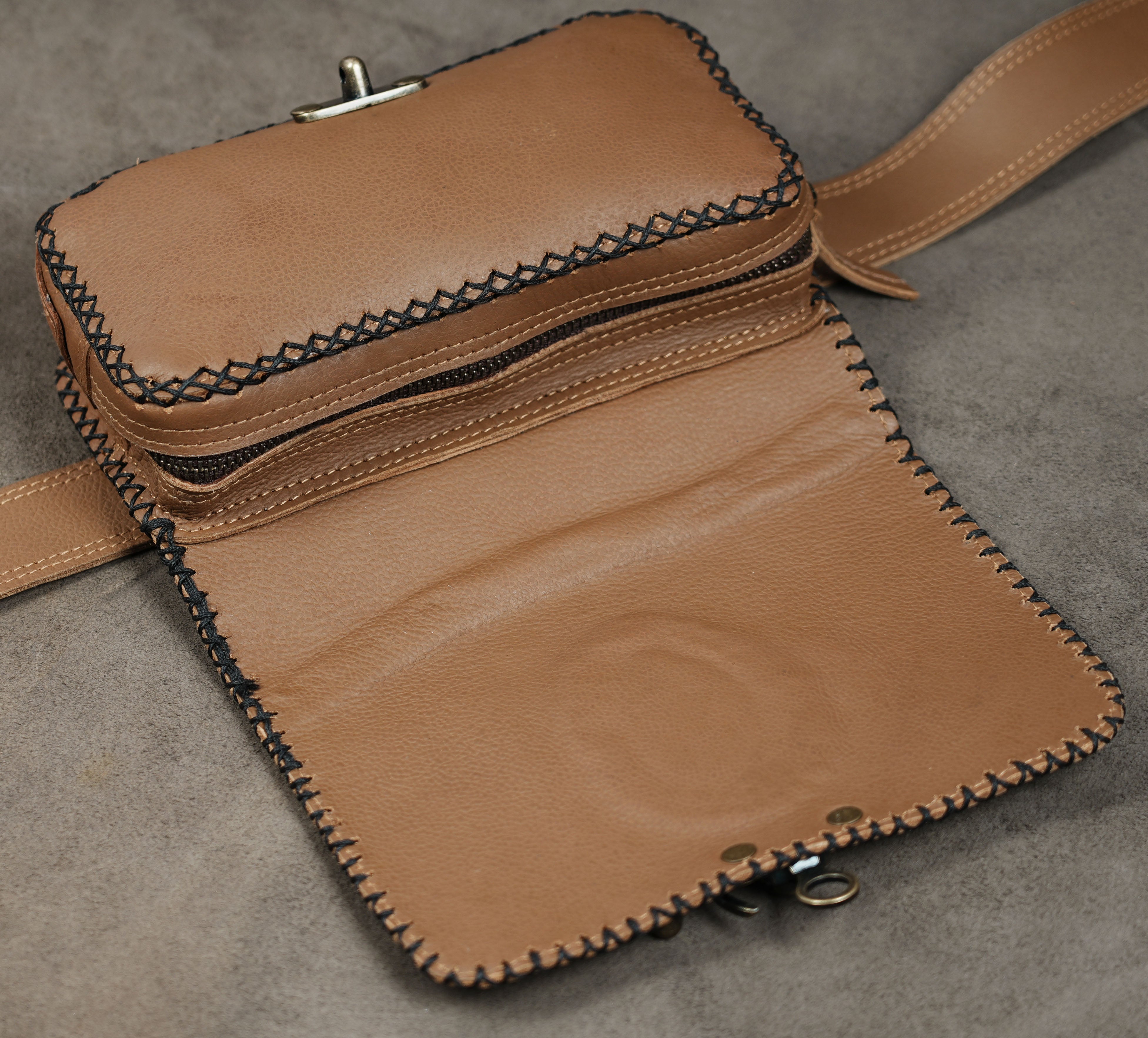 Rustic brown leather waist pouch with brass closure