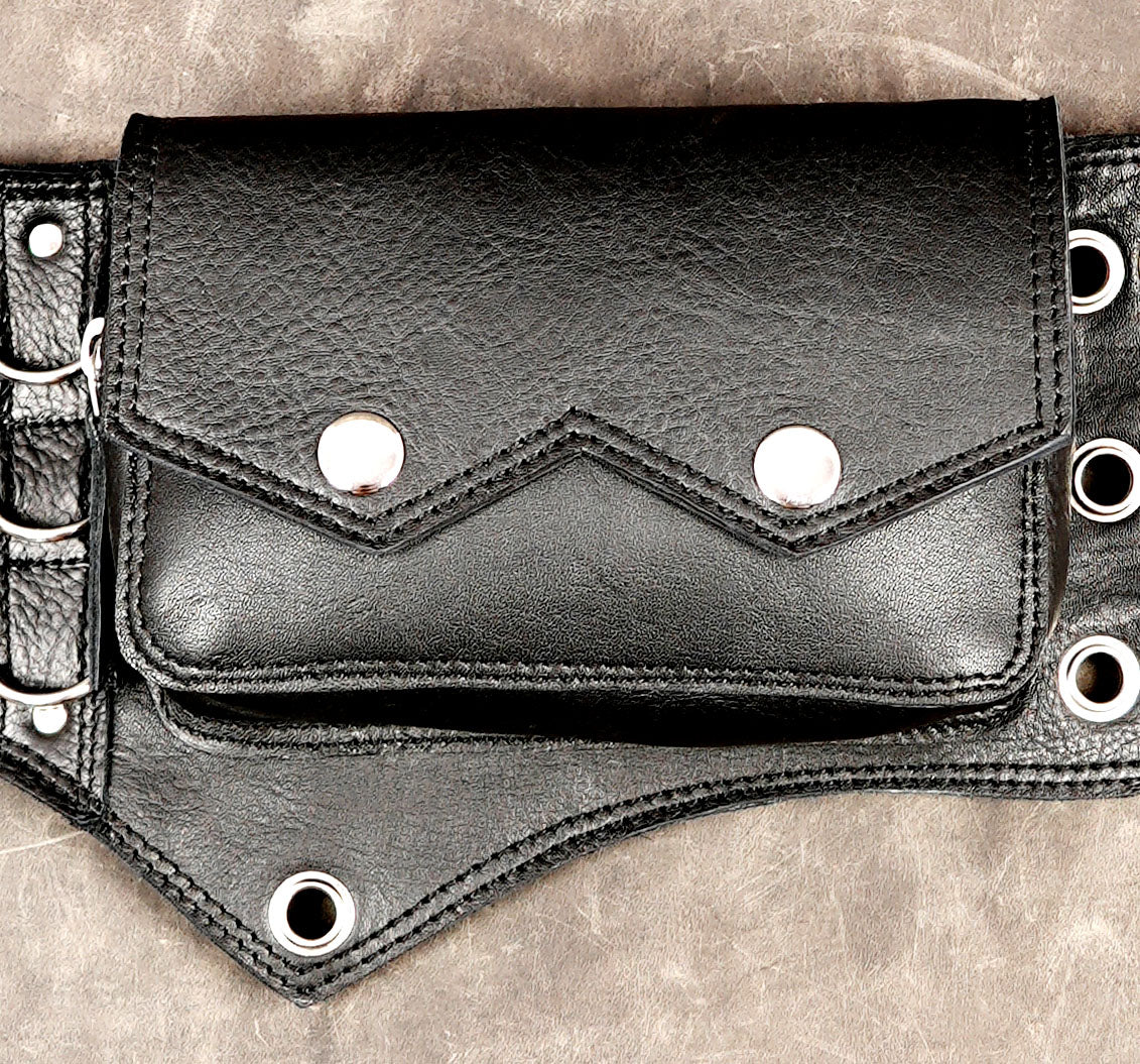 Steampunk leather belt with grommet center panel, flat lay