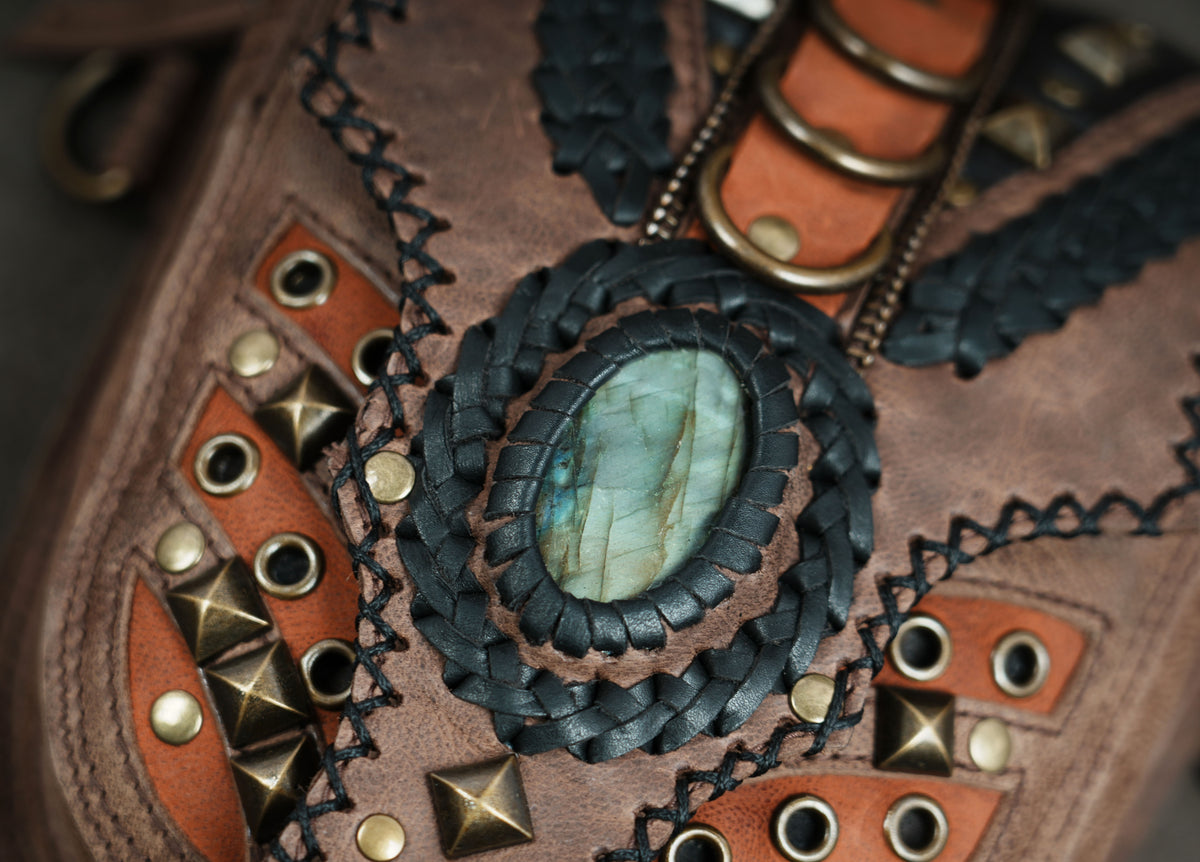 Steampunk shoulder harness bag on gray background