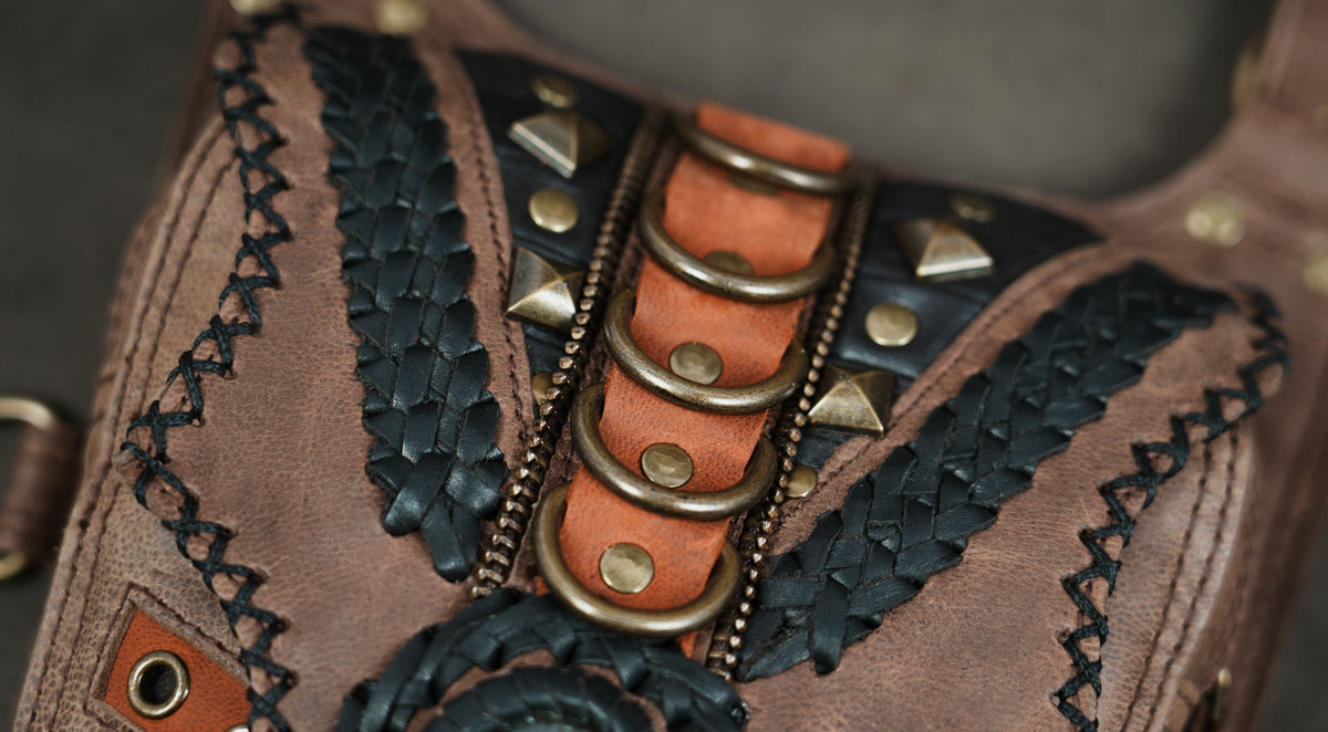 Studded leather harness bag with gemstone accents