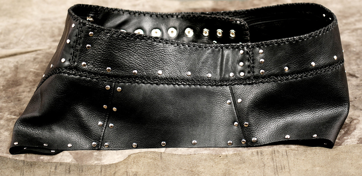 Studded leather mini skirt with hand-stitched edges