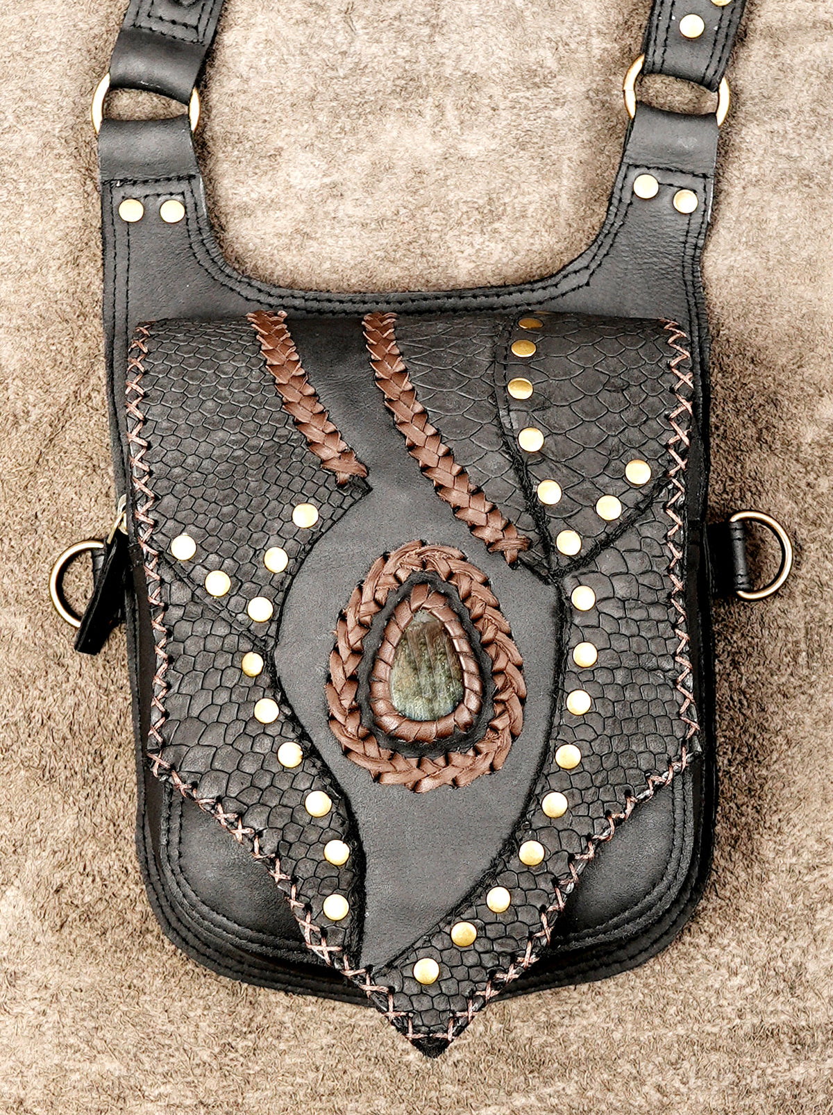 Black leather steampunk holster harness with dual pouches and decorative stone settings
