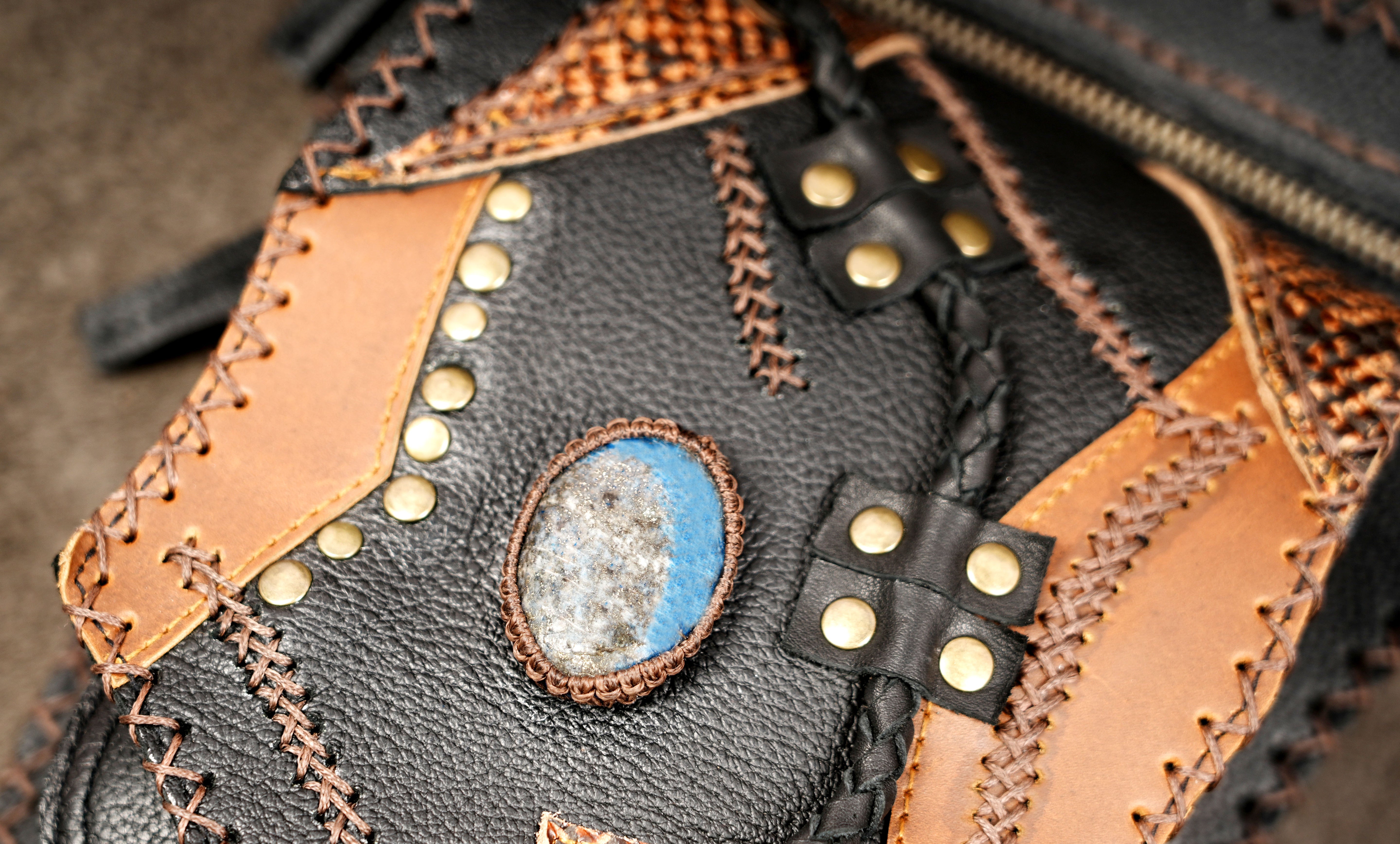 Tribal leather pouch with brass studs and zip front pocket