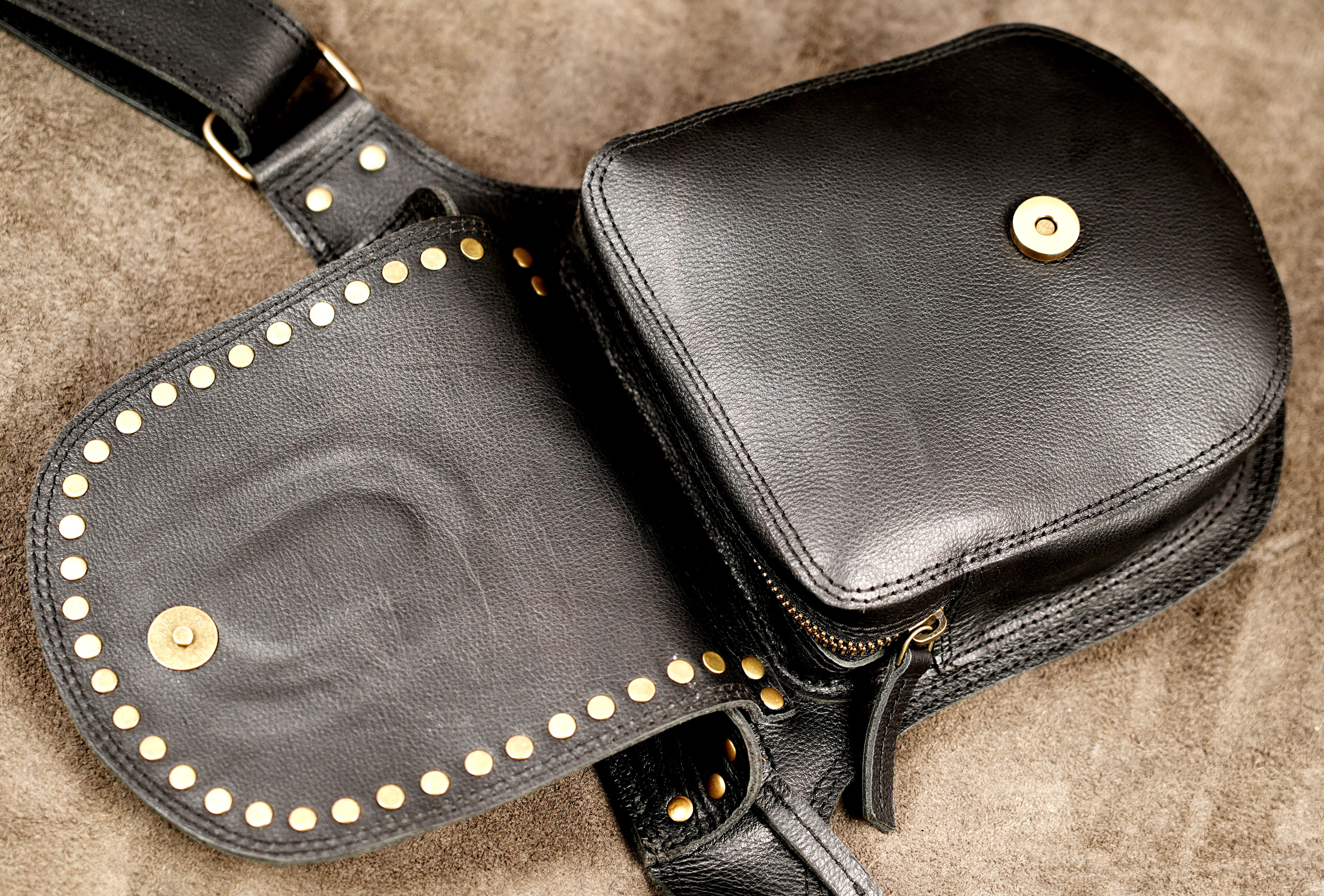 Tribal style leather hip bag with tooled stone design