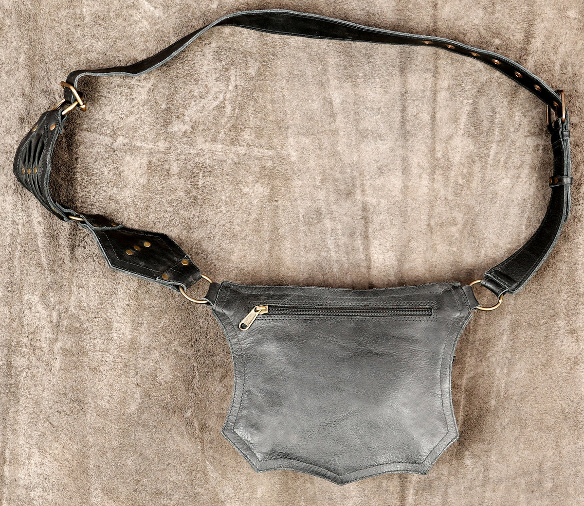 Black leather hip pouch laid flat showing full adjustable belt strap