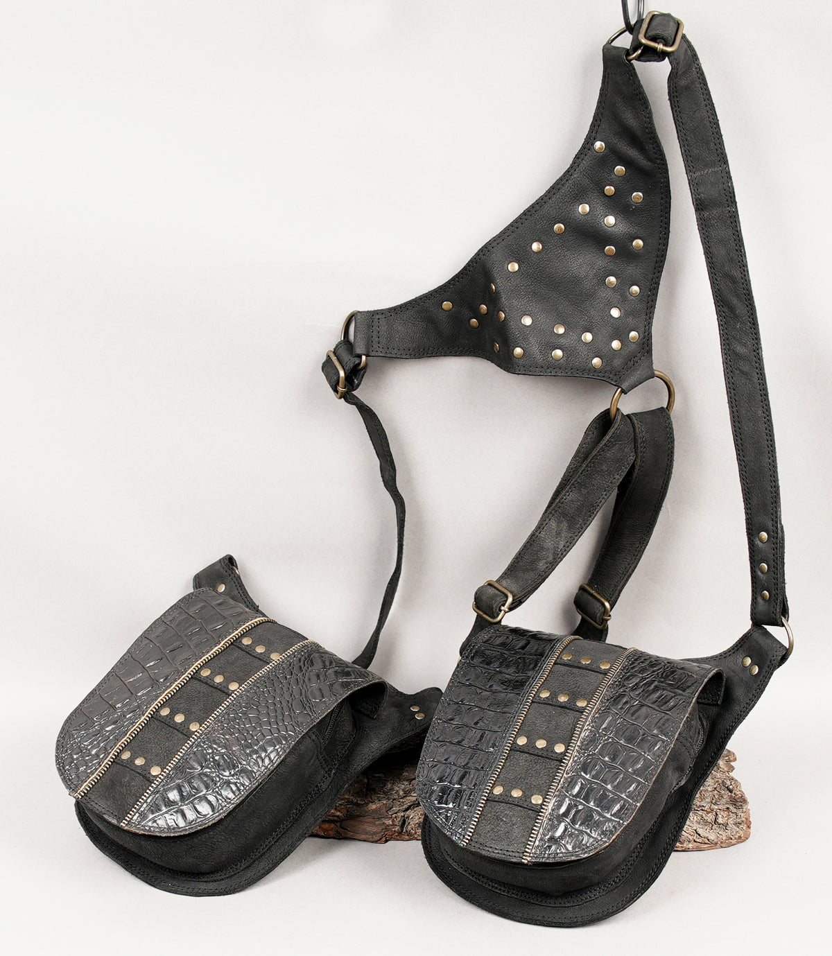 Black leather chest harness with dual pockets and shoulder bags