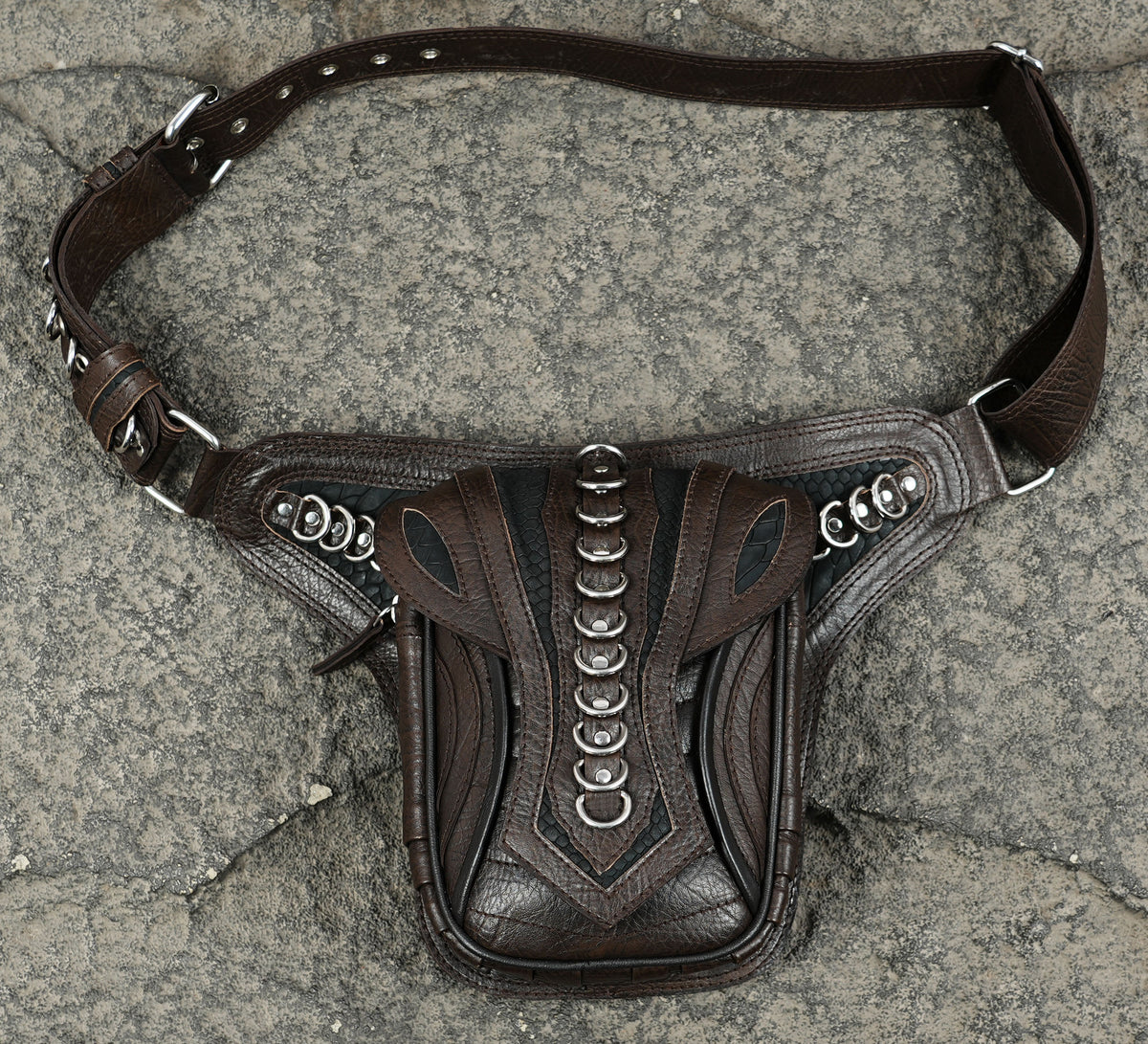Warrior chic leather bag with silver hardware spine