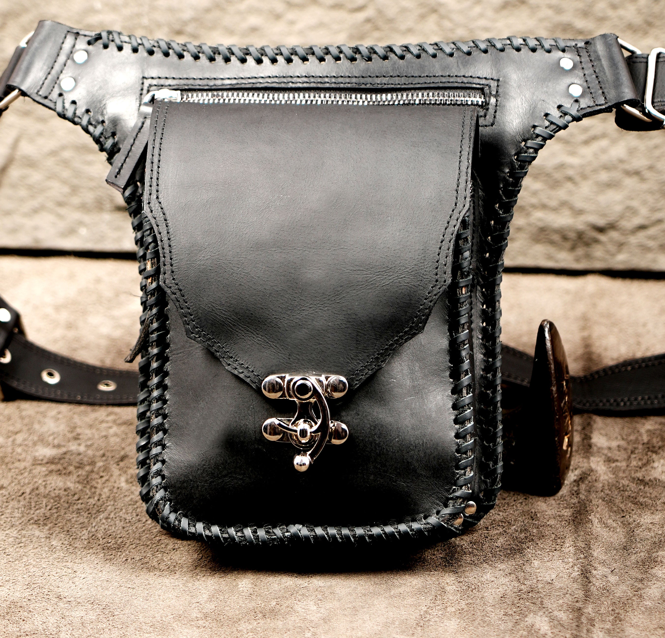 Western leather bag with whipstitch trim, top flat lay view