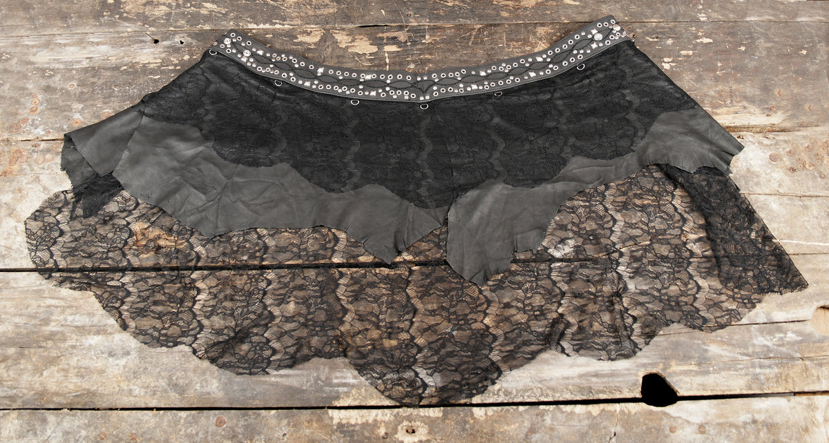 Women’s layered black gothic skirt combining leather and lace