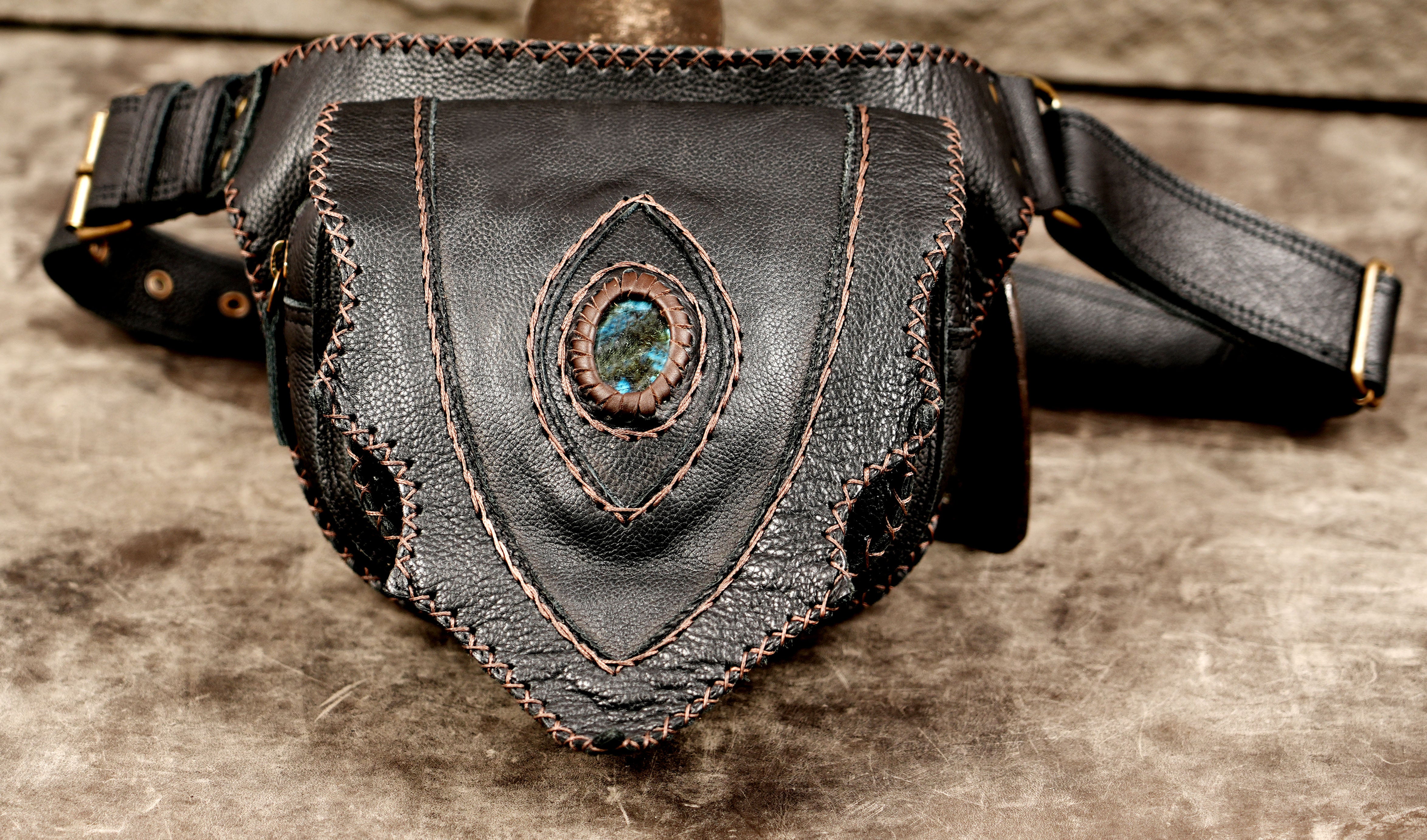 Boho black leather hip pouch with decorative stitching