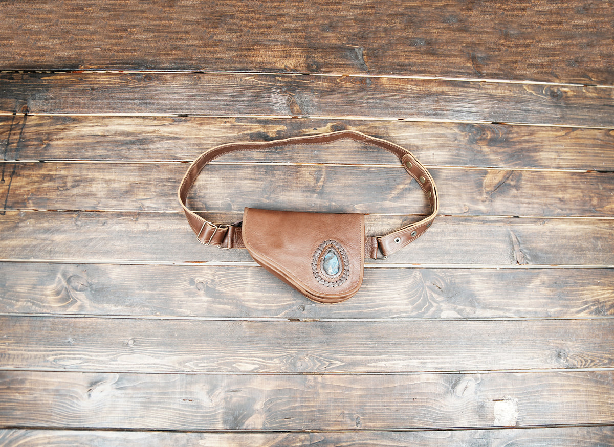 White leather belt bag with braided trim, flat lay view