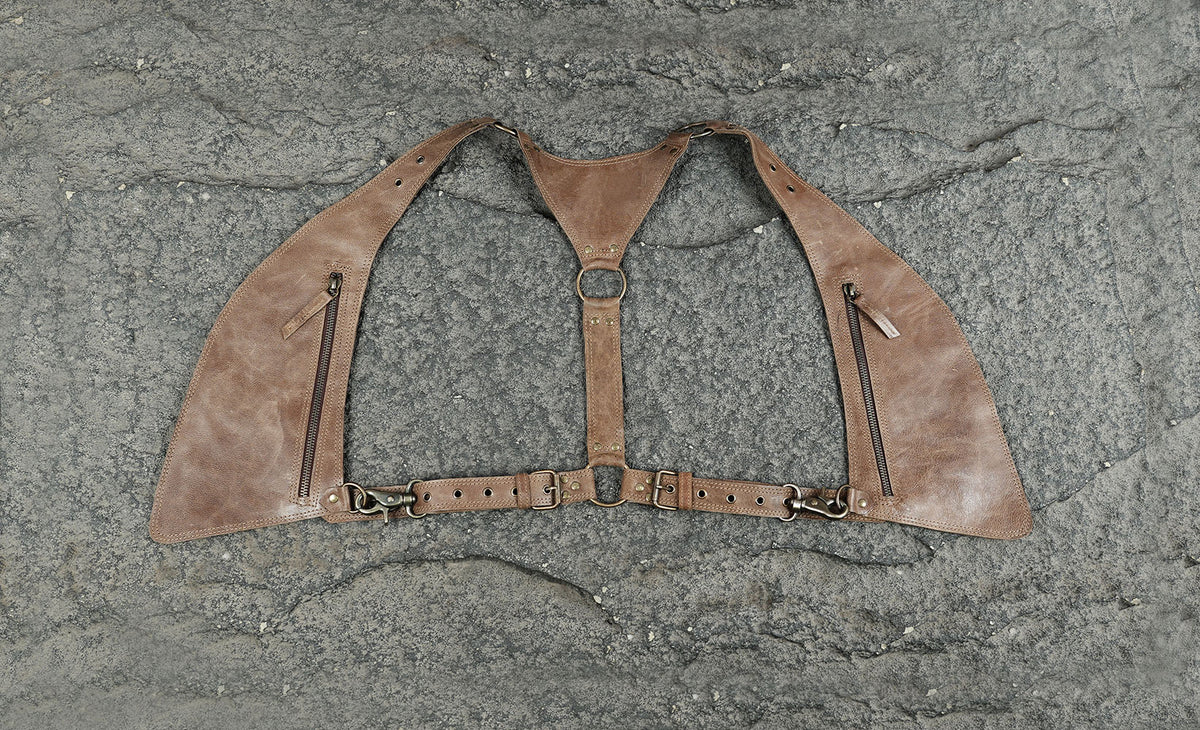 Adjustable leather shoulder holster with waist belt and zipper pockets