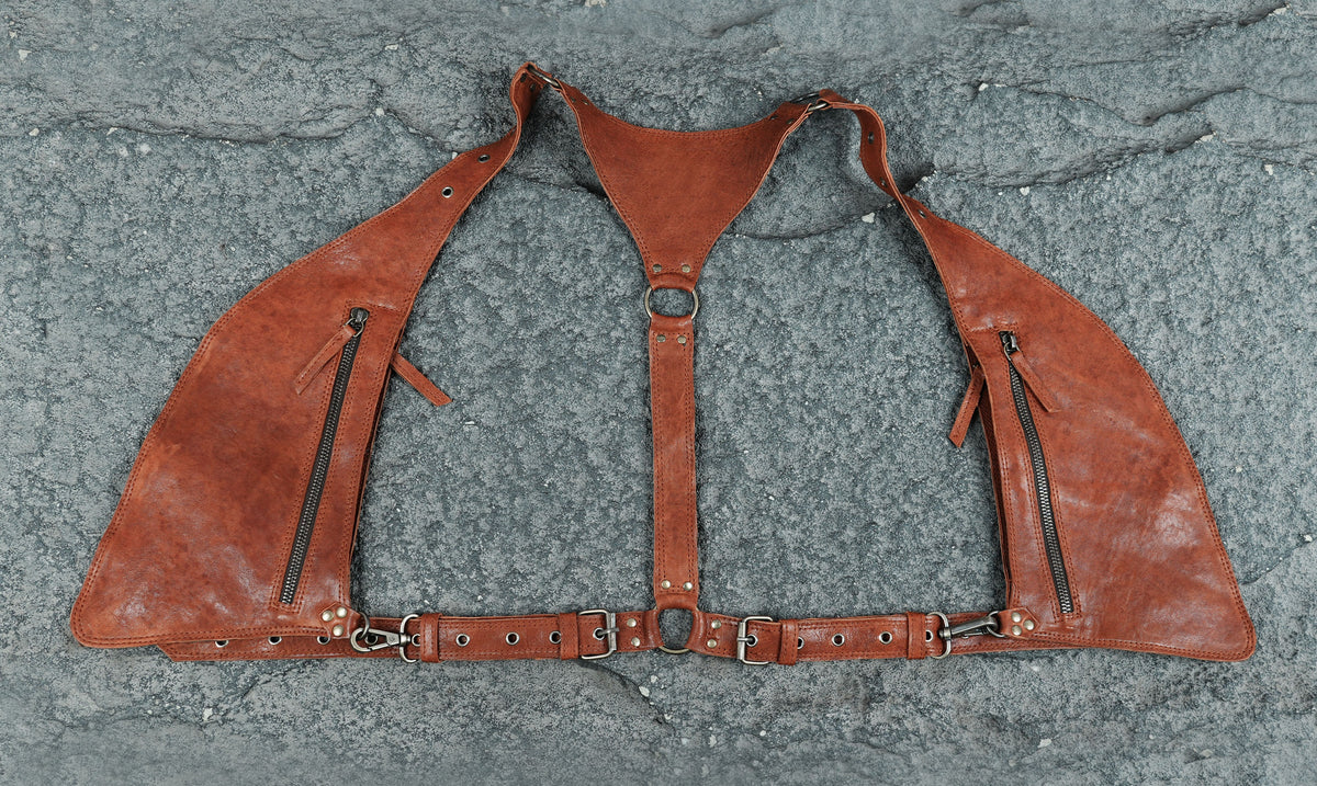 Adjustable black leather shoulder harness bag with waist support strap