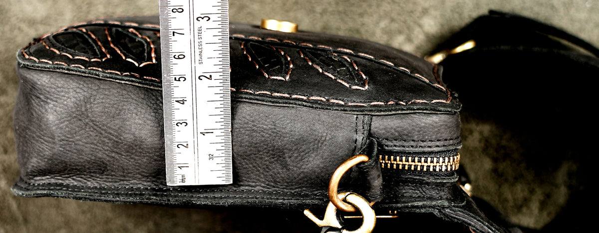 Black leather cowgirl hip bag with antique gold studs and stitching