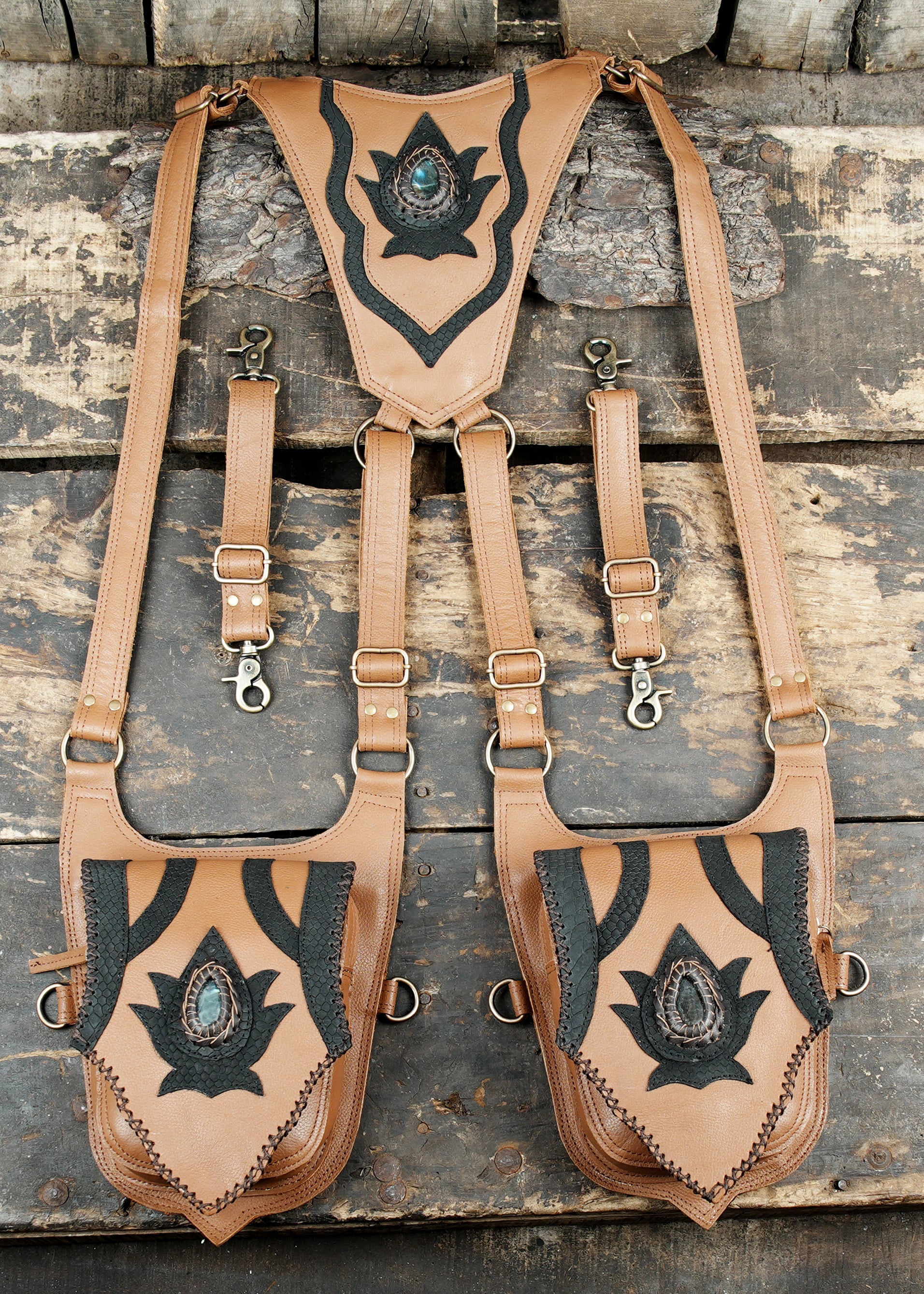 Brown leather festival holster with lotus motif and metal hardware