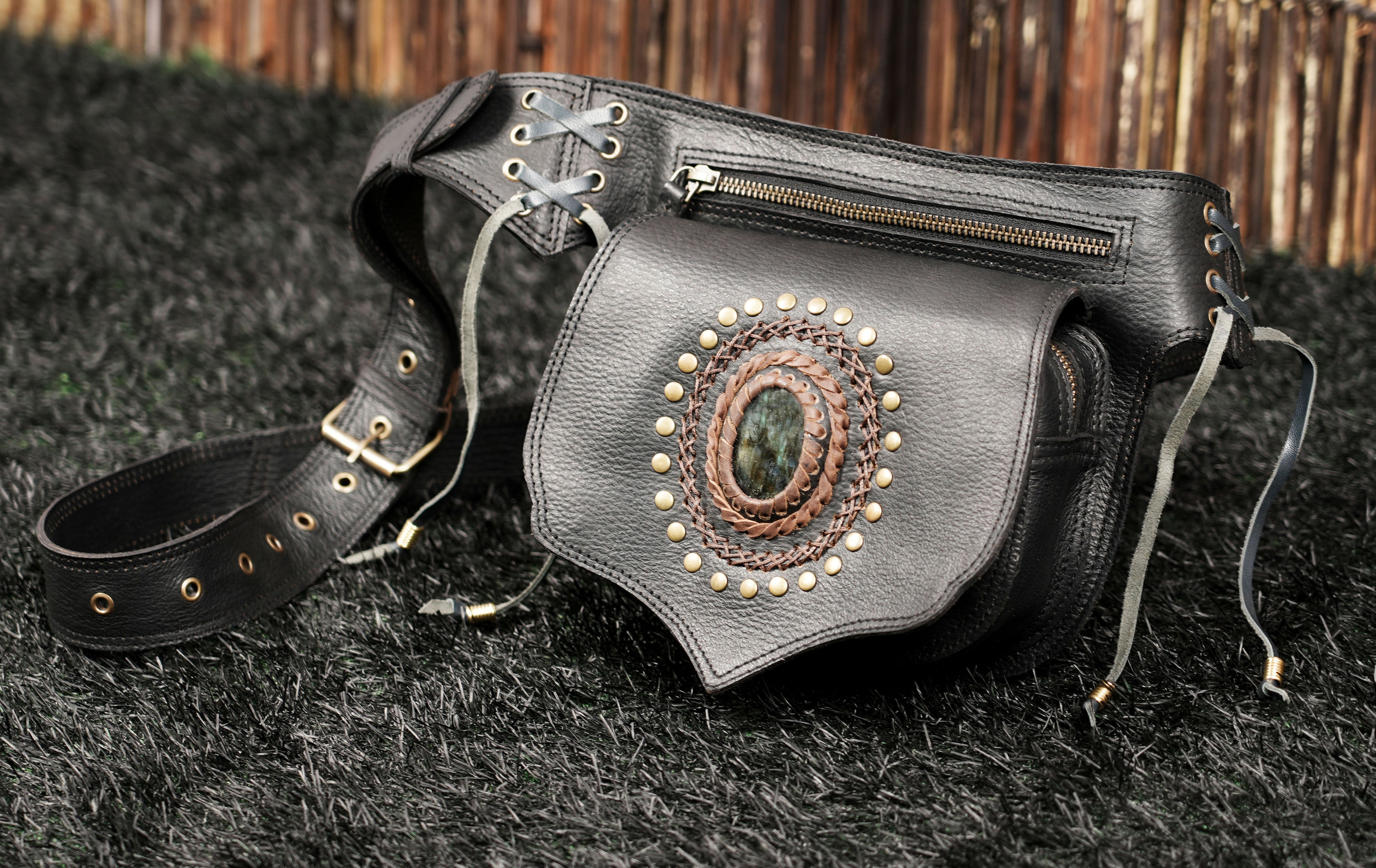 Black leather utility belt bag with natural labradorite gemstone and adjustable buckle strap.